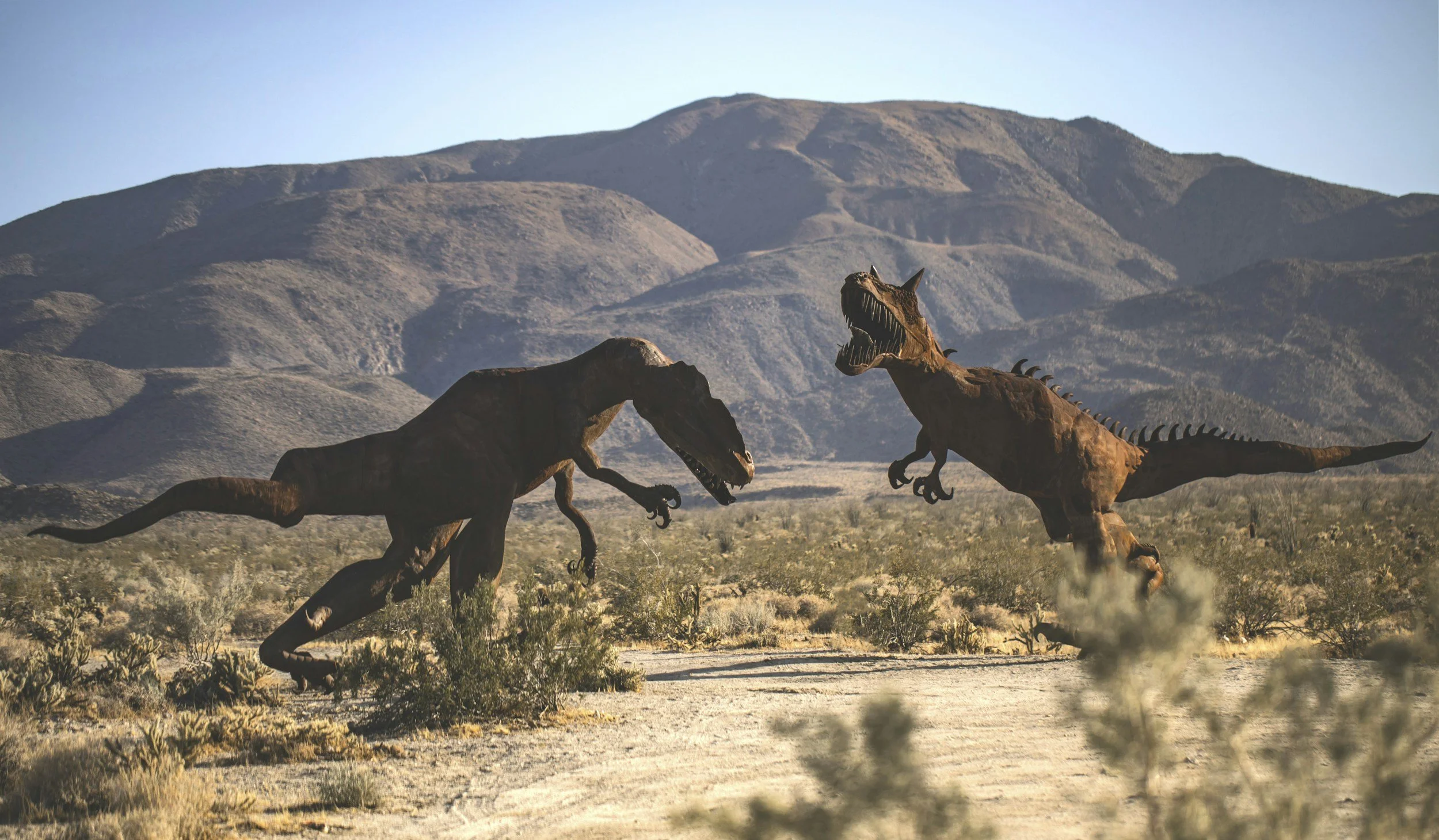 Two dinosaur models 'fighting in Anza Borrego State Park