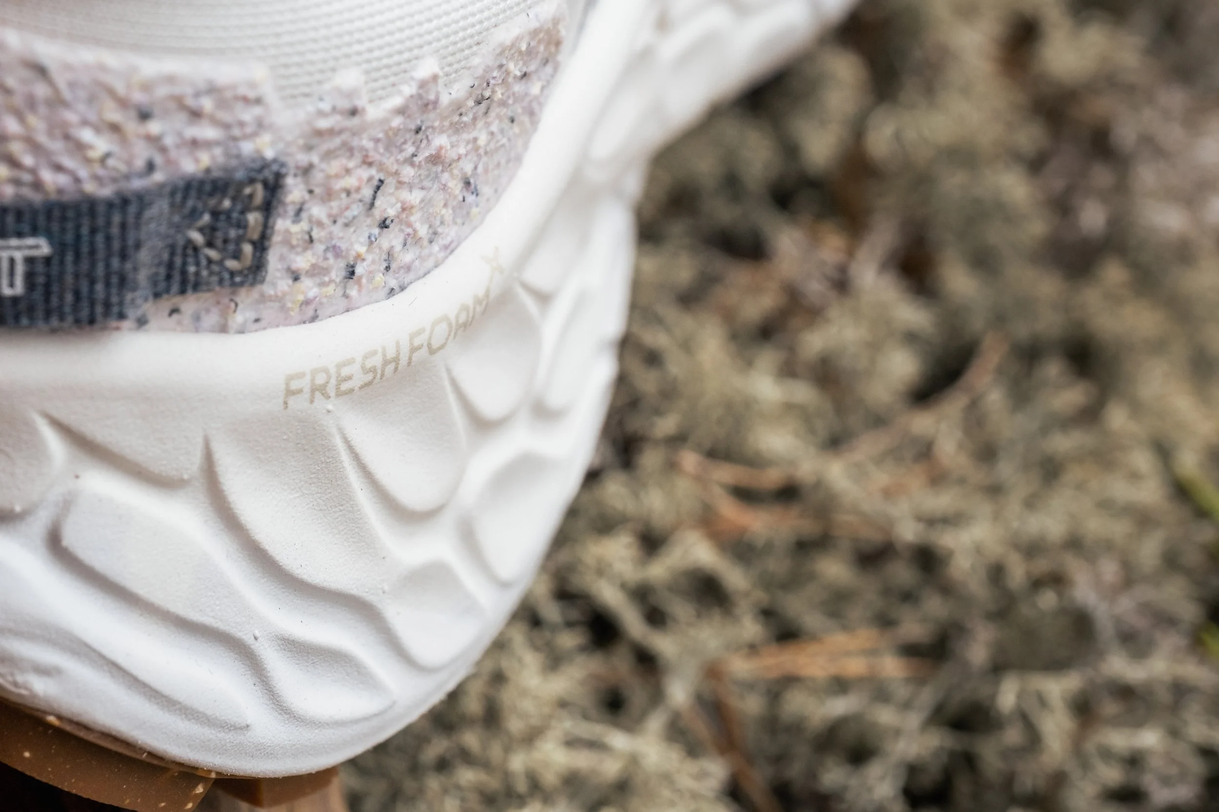 Close-up of a New Balance Fresh Foam sole on moss