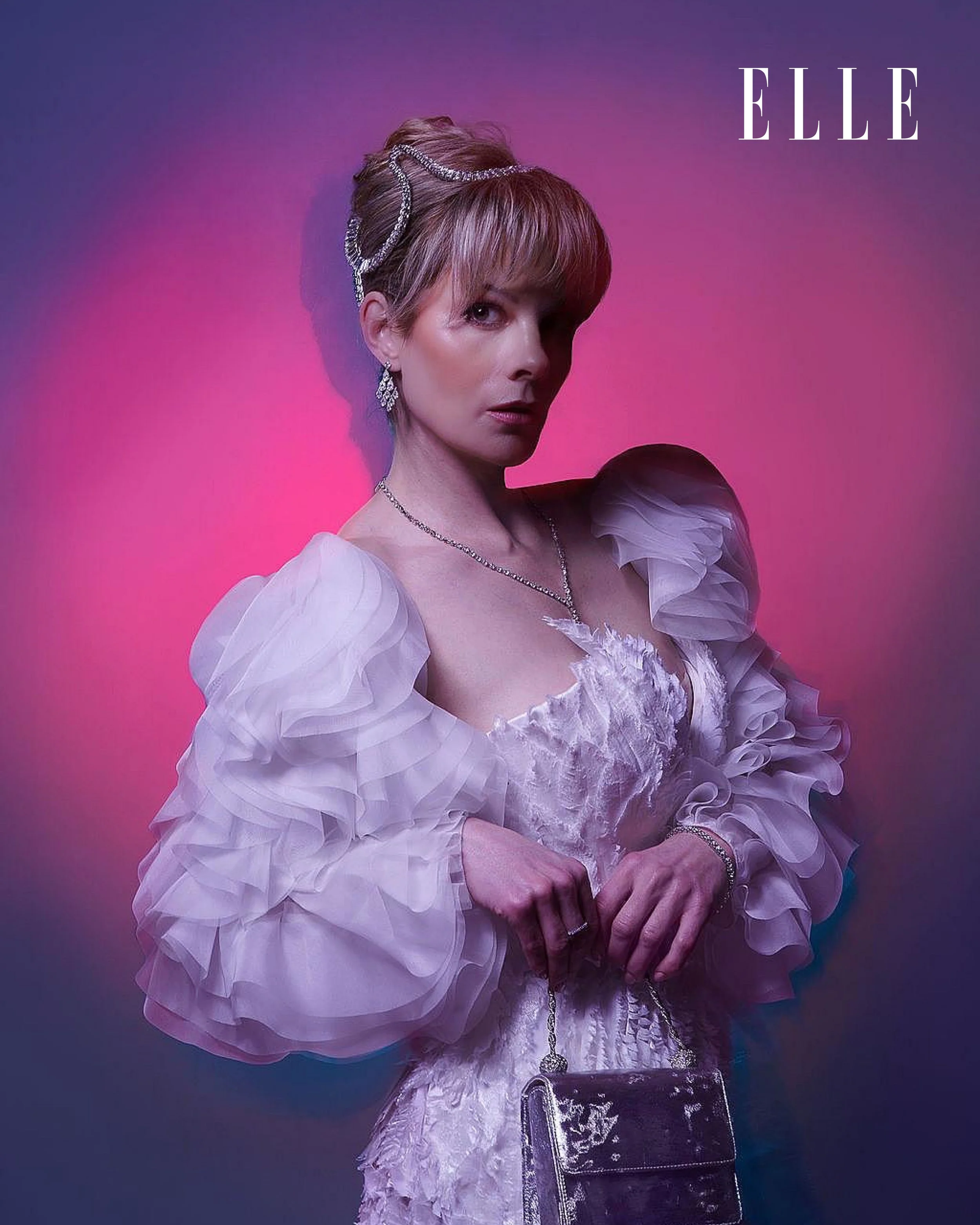 DeeHake Editorial Model in white jacket Elle April 2026.jpg