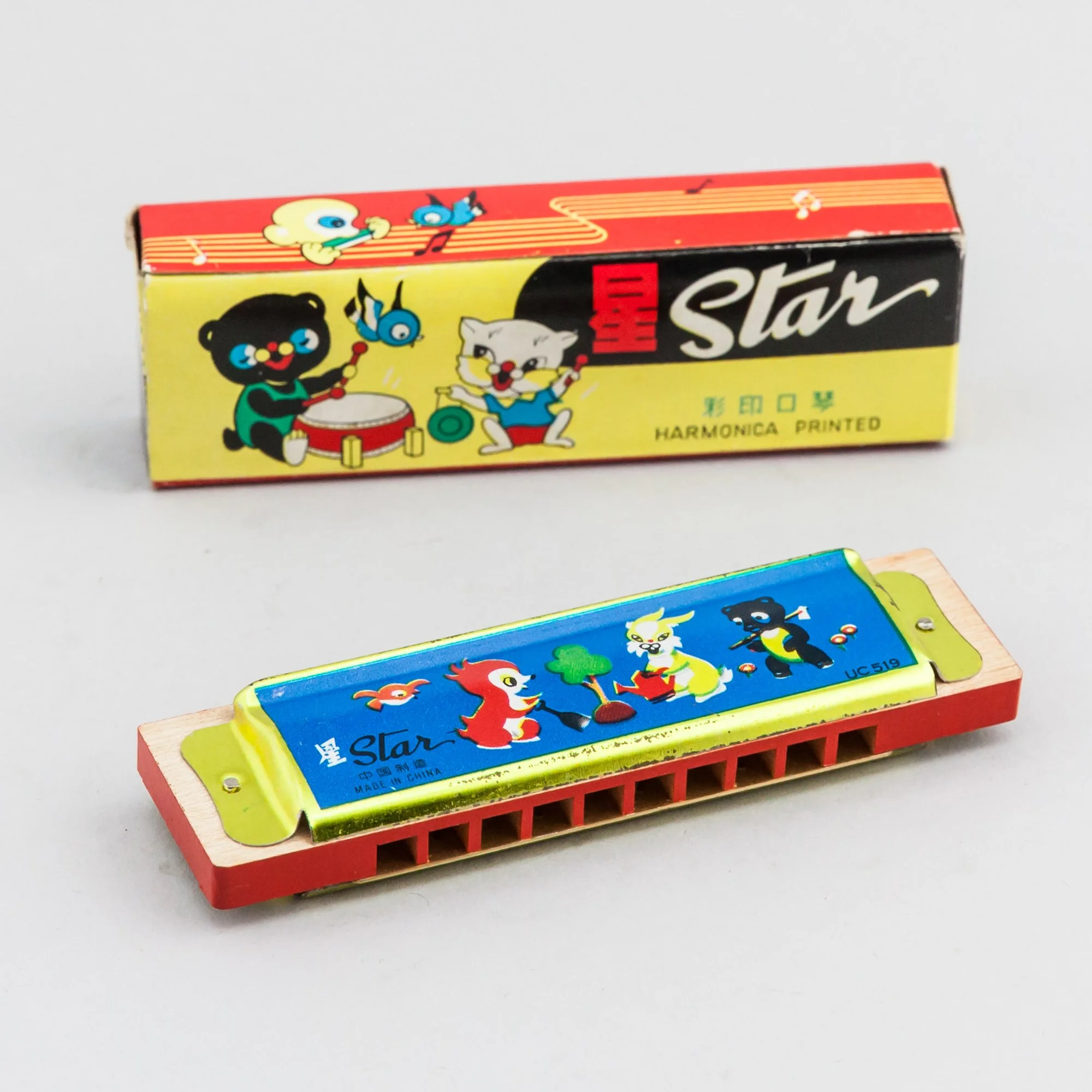 STAR illustrated harmonica
