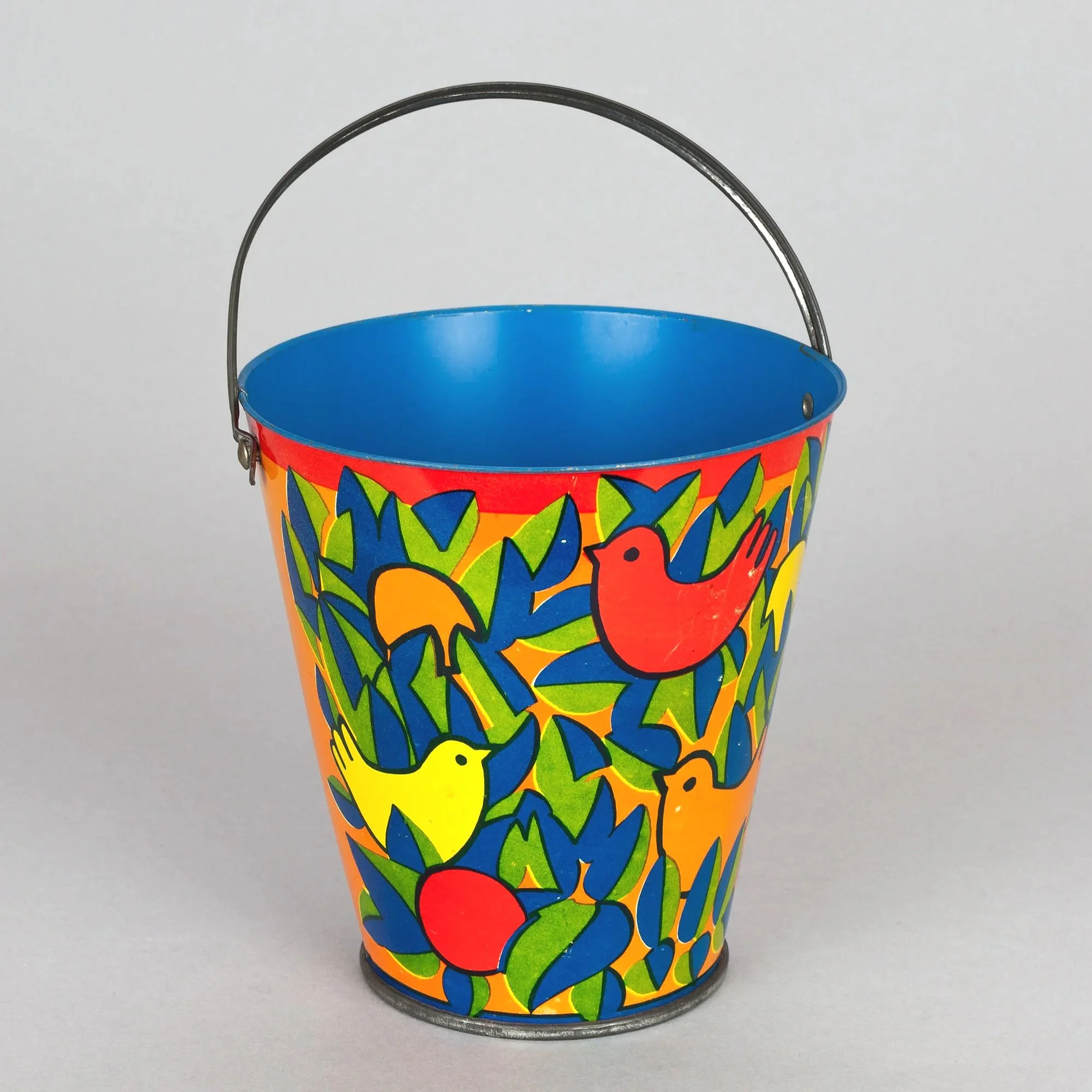 Tin bucket with birds