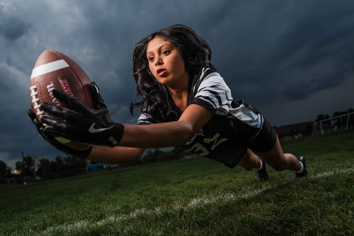 Oh, we love when the Colorado weather shows up to play! That sky did us a favor for this session. And Lakewood Flag Football showed up ready to compete.

First frame: full extension, chasing it.
Second: the whole crew together.
Third: another one tra