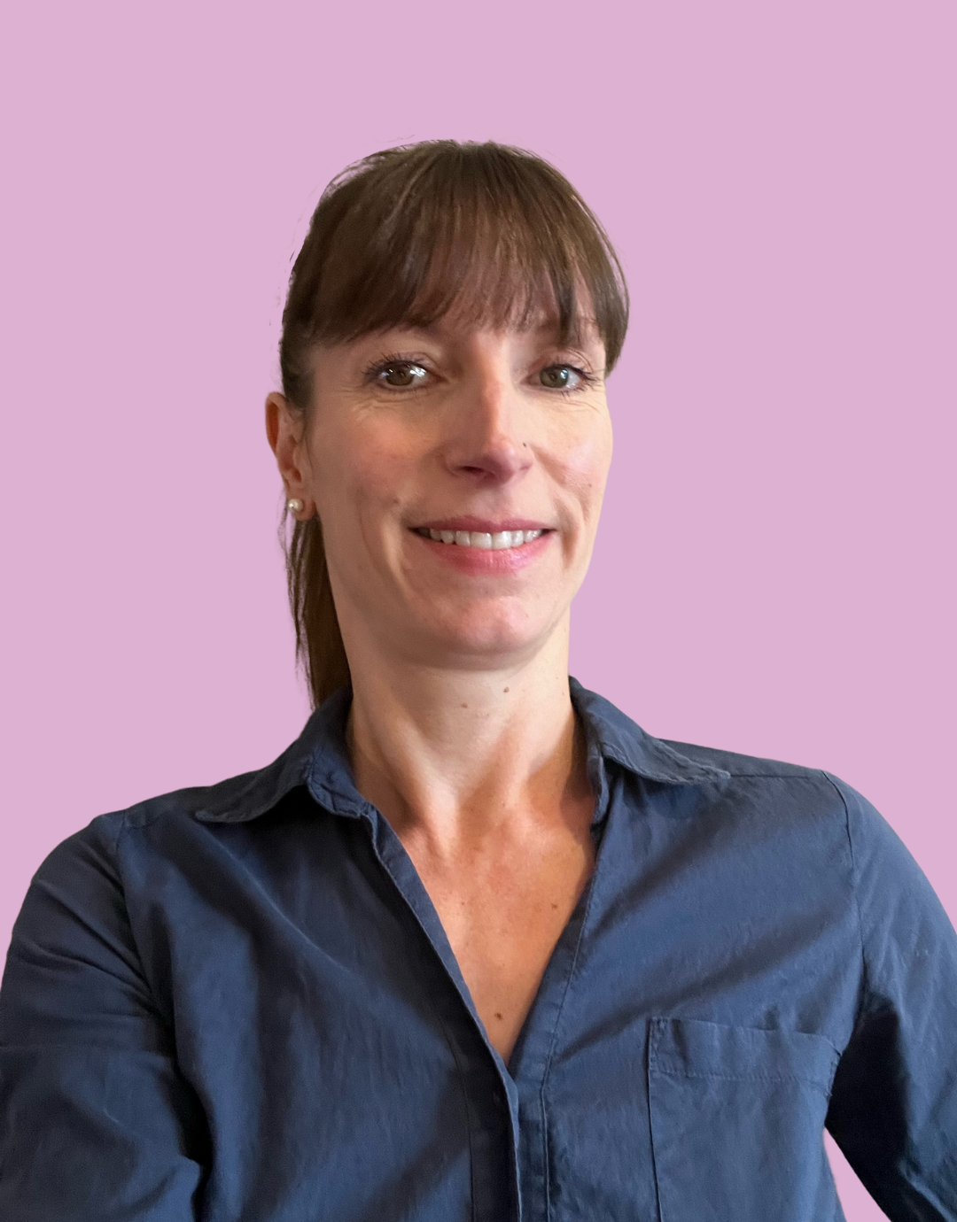 Close-up of a smiling woman with shoulder-length wavy blonde hair, wearing a floral sleeveless top, against a light green background.