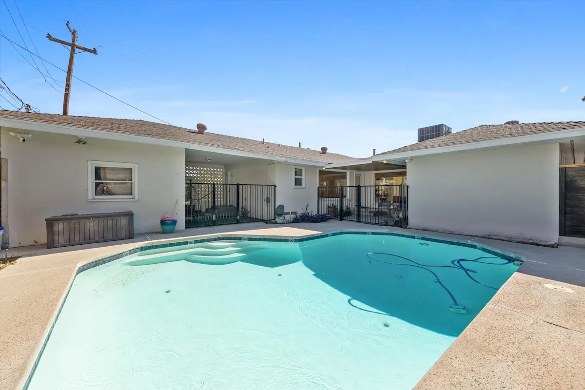 13 Pool And Patio 03 - Inviting Backyard Pool with Patio Seating Area.jpg
