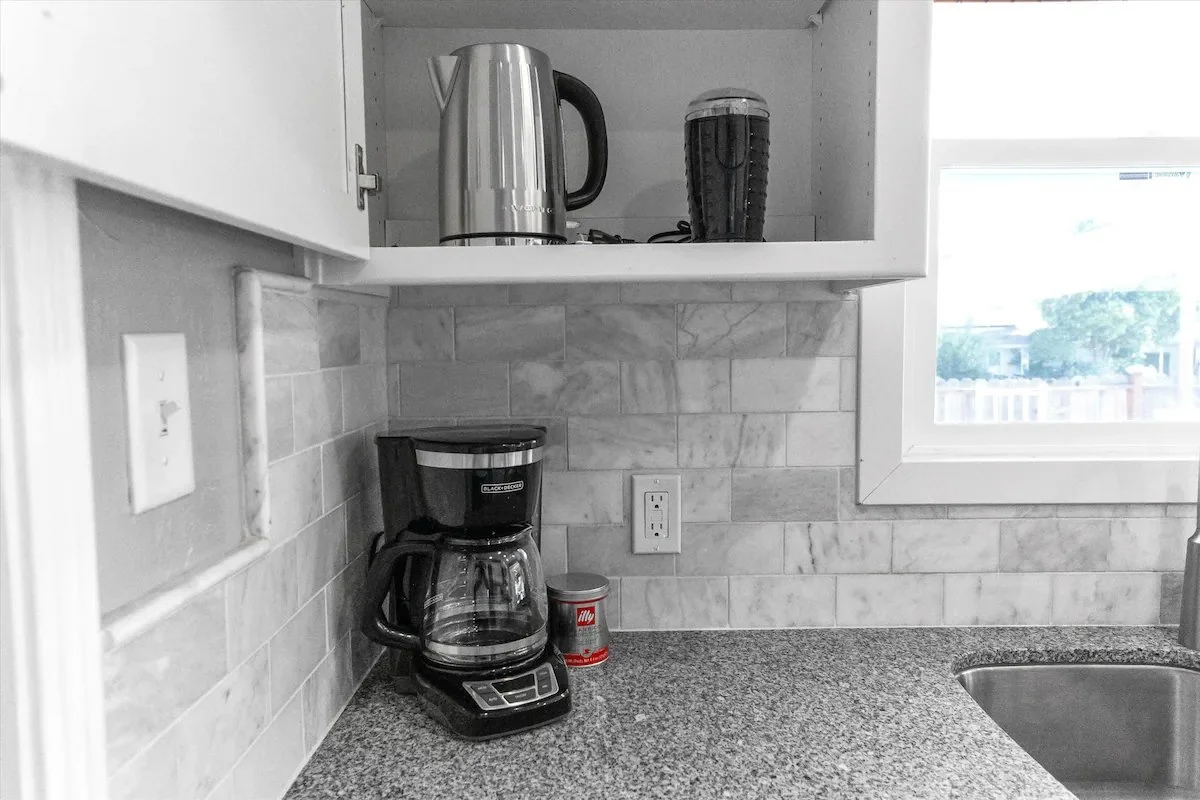 09 Kitchen 08 - Well-Equipped Kitchen Counter with Coffee Maker and Kettle.jpg