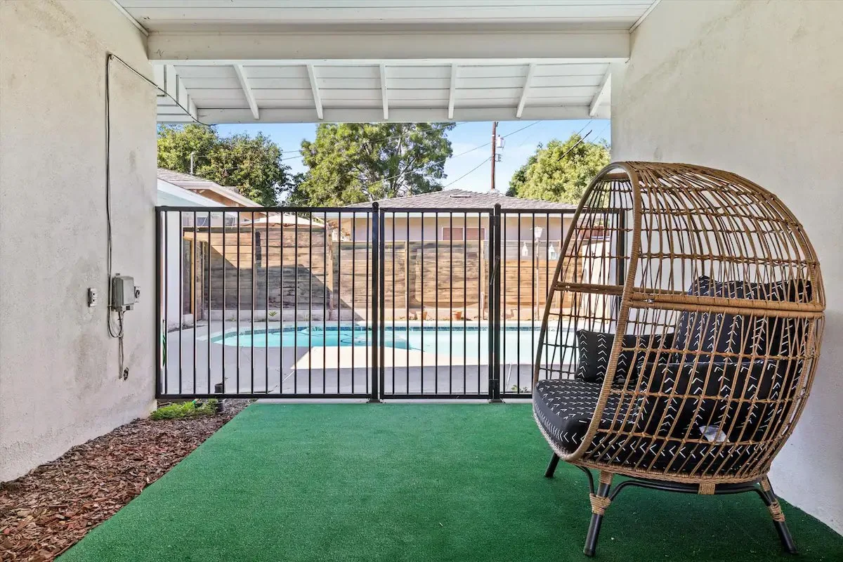 13 Pool And Patio 04 - Cozy Patio with Hanging Chair Overlooking Pool.jpg