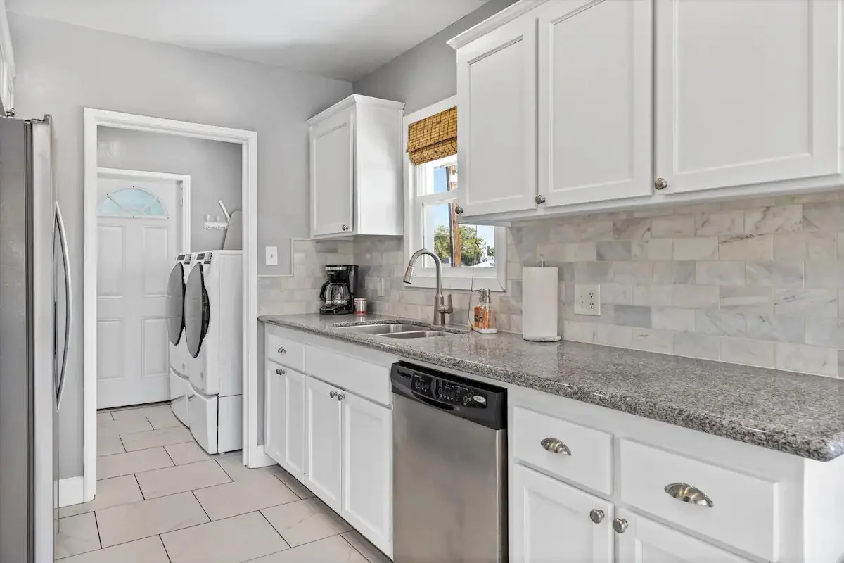 09 Kitchen 12 - Bright and Modern Kitchen with Adjacent Laundry Area.jpg