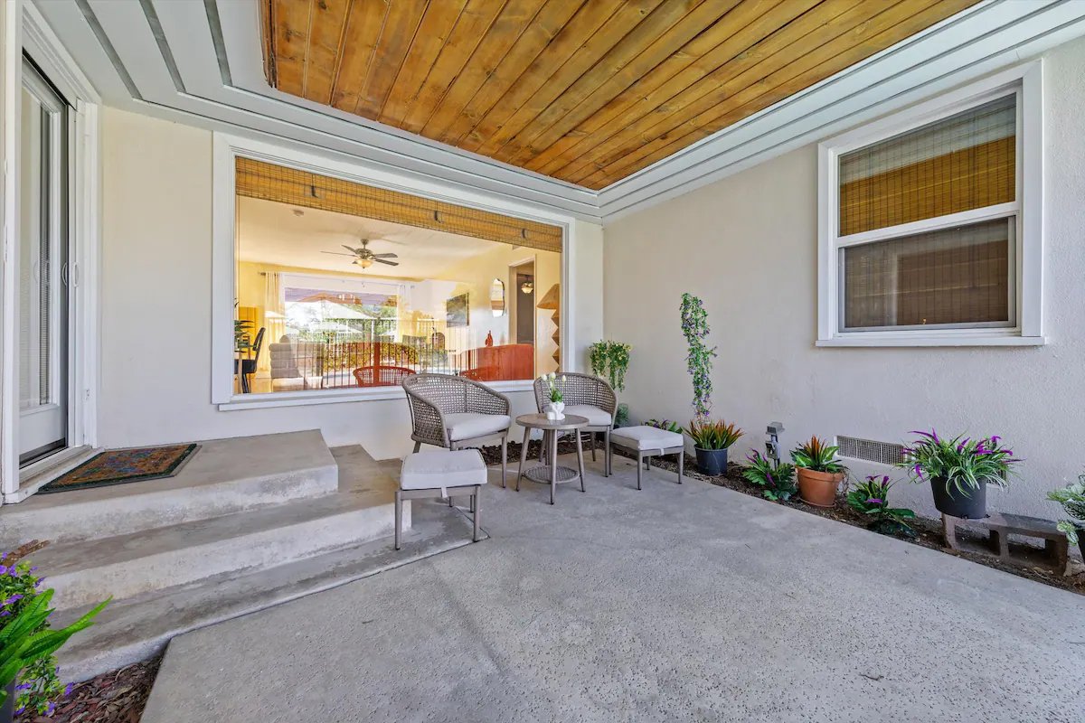 13 Pool And Patio 01 - Inviting Patio with Cozy Seating Area and Garden View.jpg