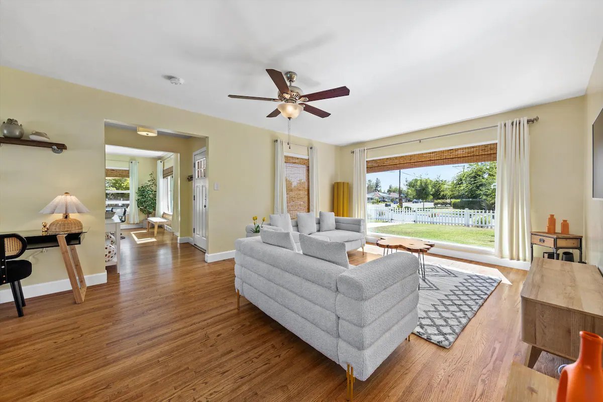 03 Living Room 03 - Bright and Airy Living Room with Large Window and Modern Decor.jpg