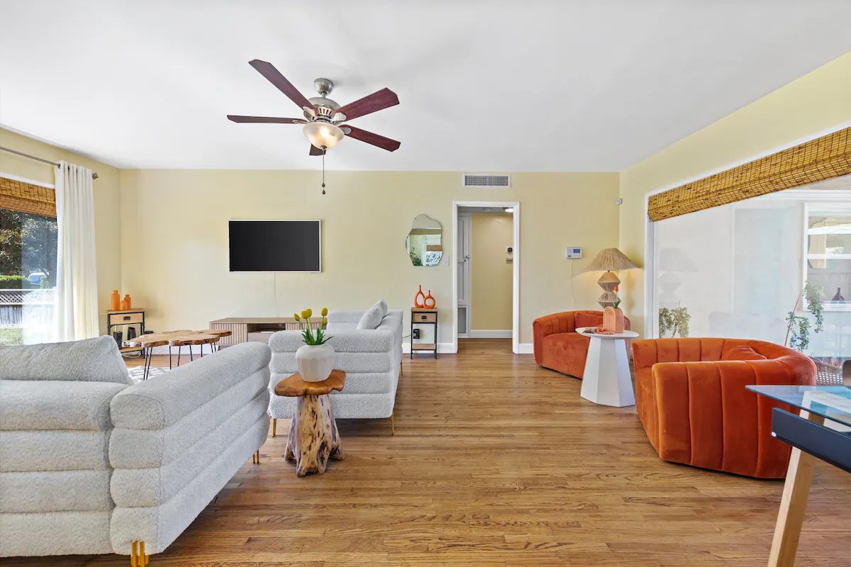 03 Living Room 01 - Spacious Living Room with Modern Decor and Natural Light.jpg