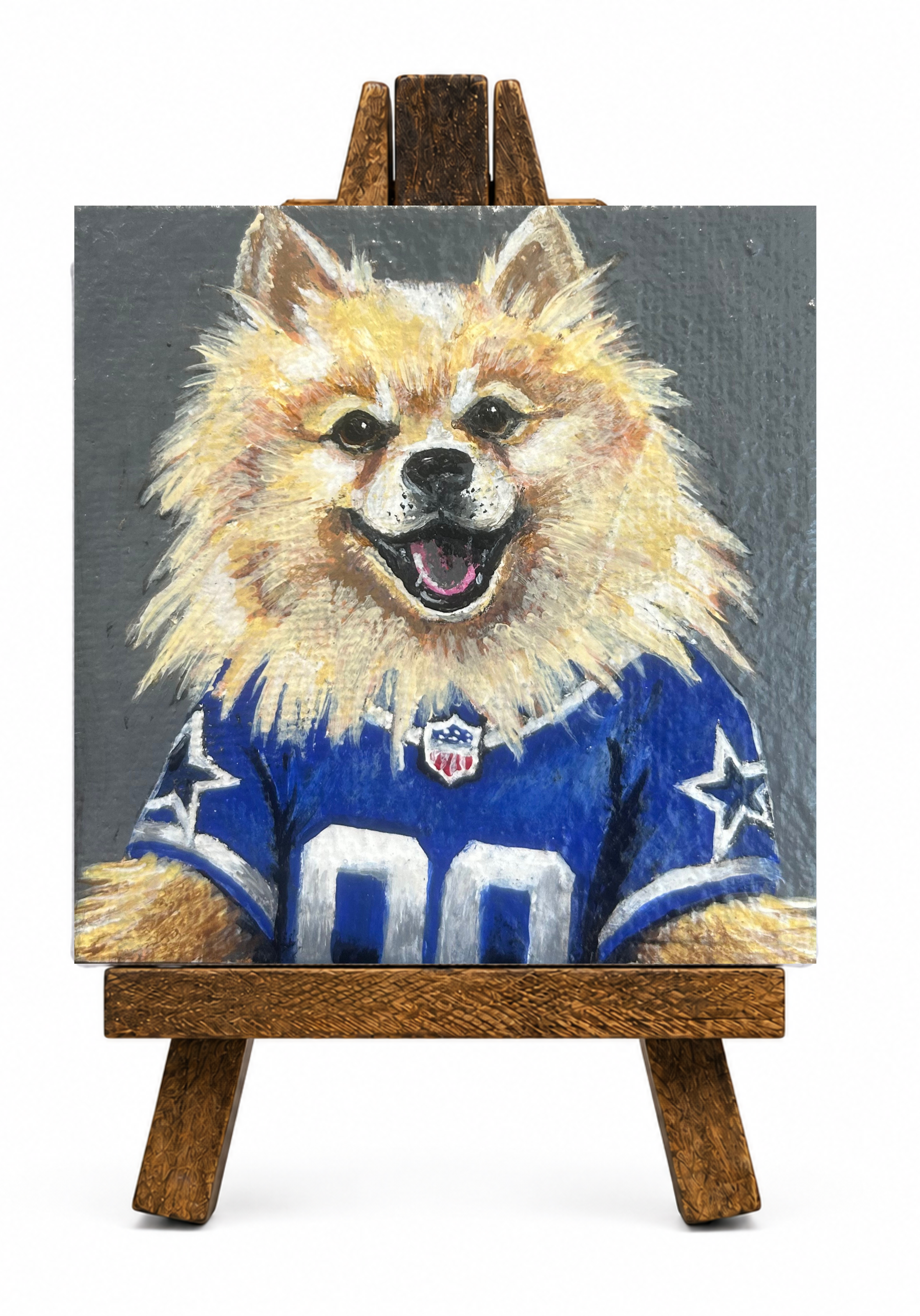 Painting of a dog wearing a sports jersey, displayed on a wooden easel