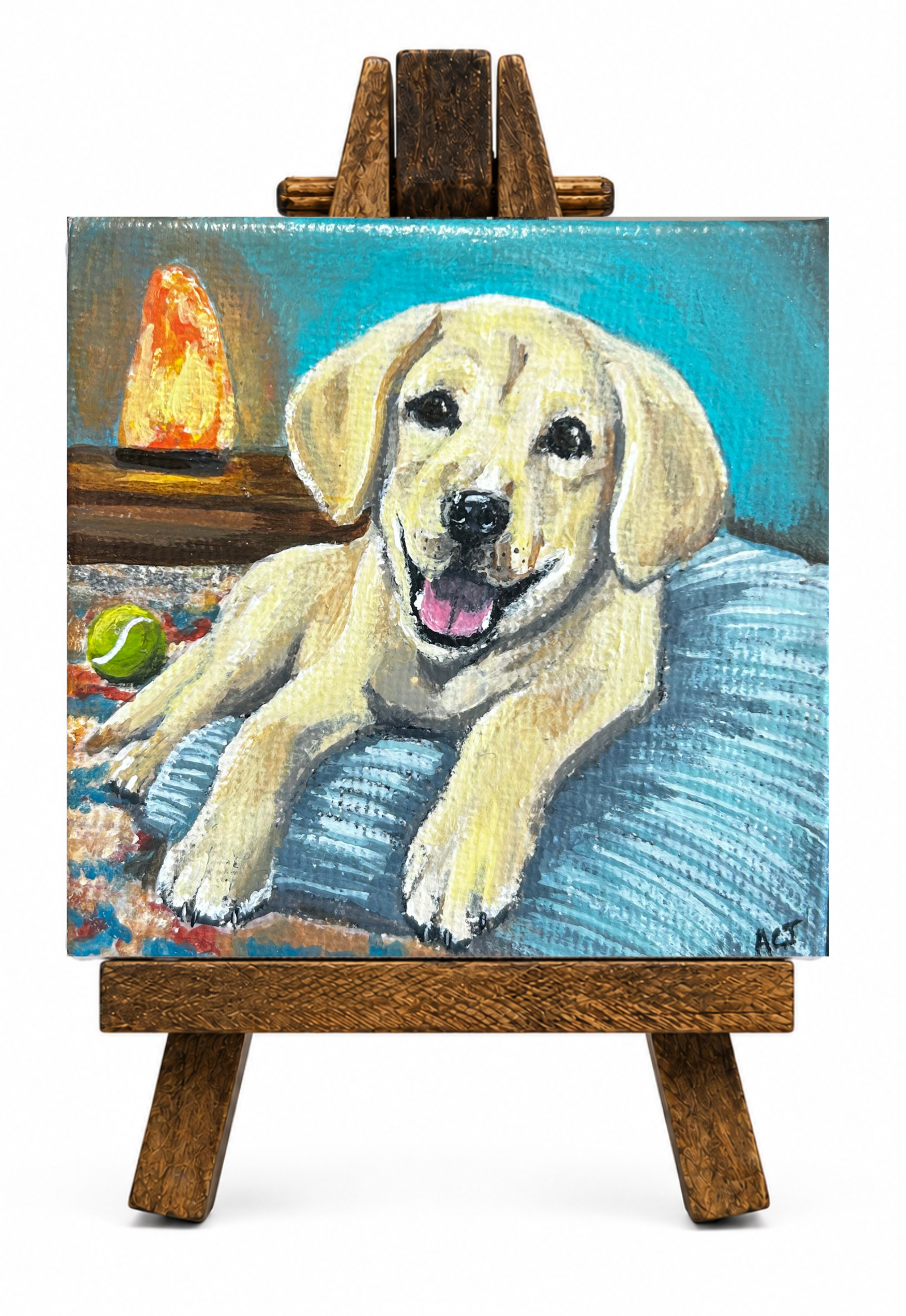 A painting of a happy yellow Labrador Retriever puppy lying on a blue surface with a tennis ball nearby, with a lava lamp and abstract background in the painting.