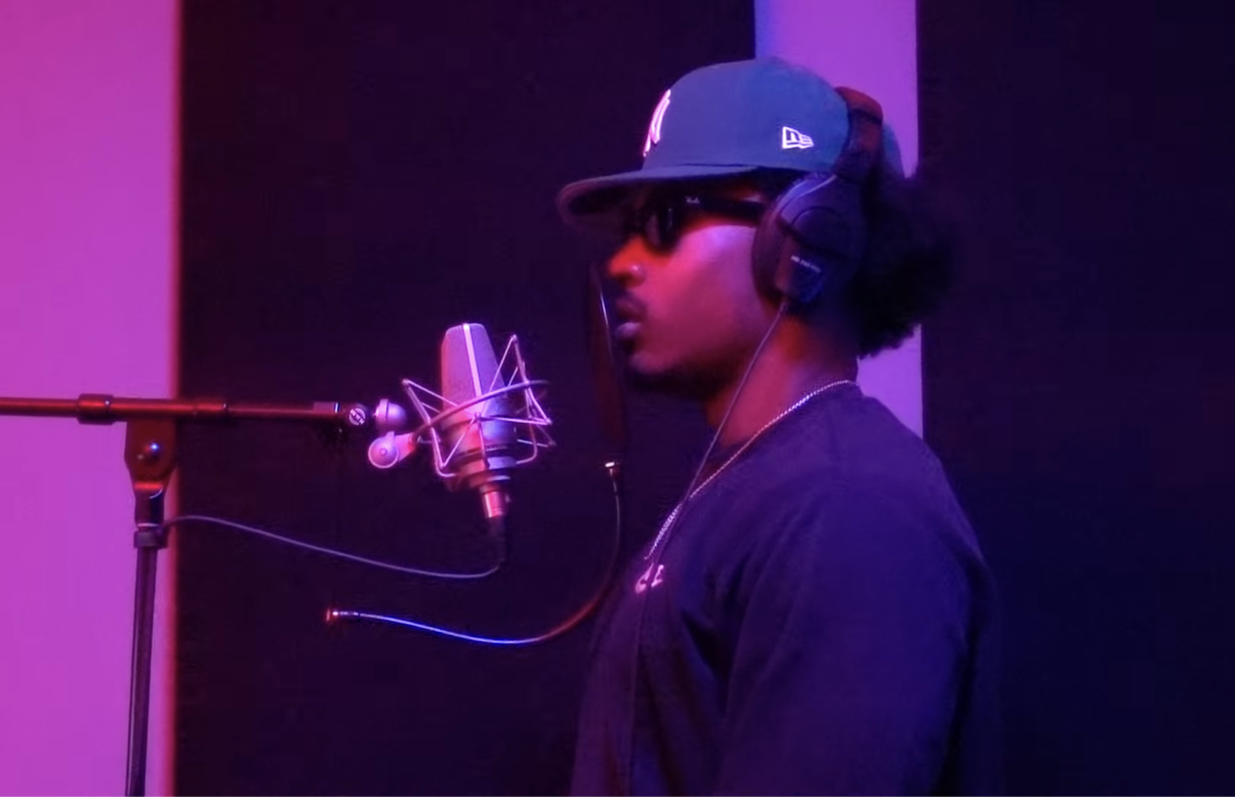 Devo singing with TLM103 Neumann microphone at Samples Studios