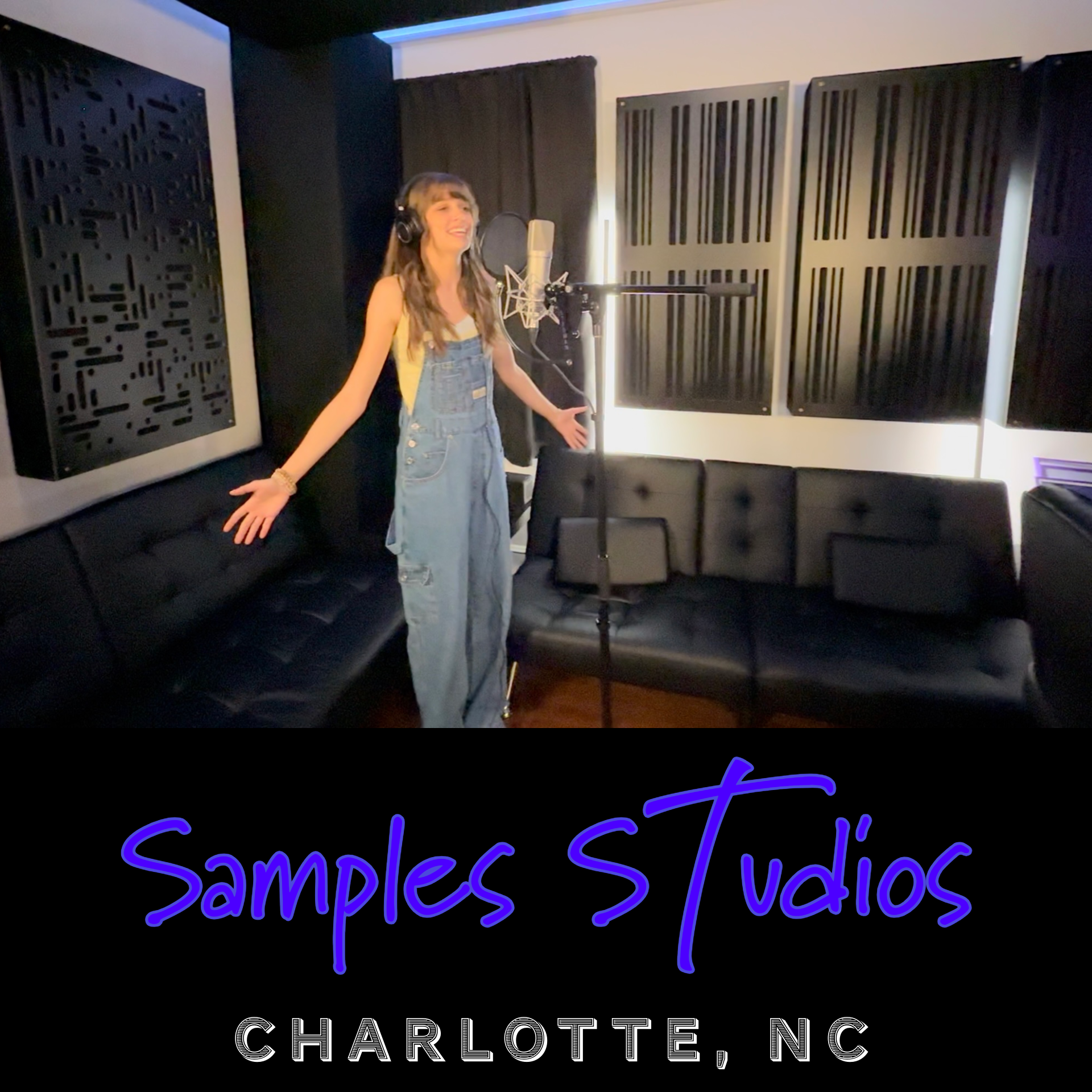 Samples Studios singer and actress Savannah Robin singing into microphone with hands raised and smiling