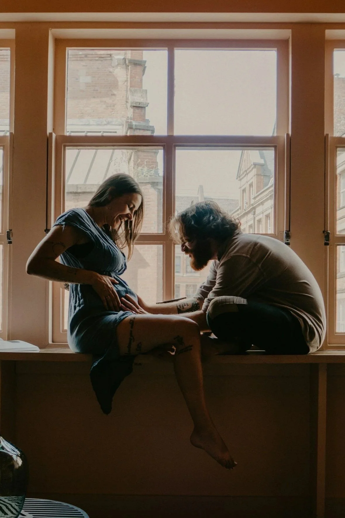 friends laughing and talking to one another outside and enjoying each other's company