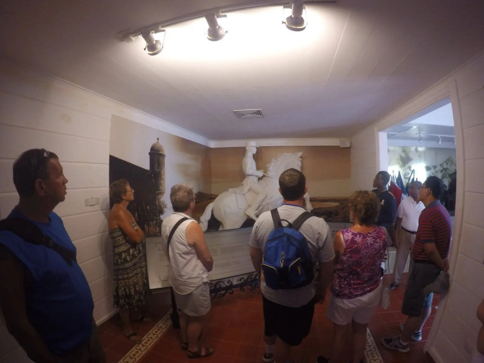 Travellers touring the Luperon Home and Museum which houses victorian furnishings. One of the many stops on the History and Lunch overlooking central park by Puerto Plata Adventures.