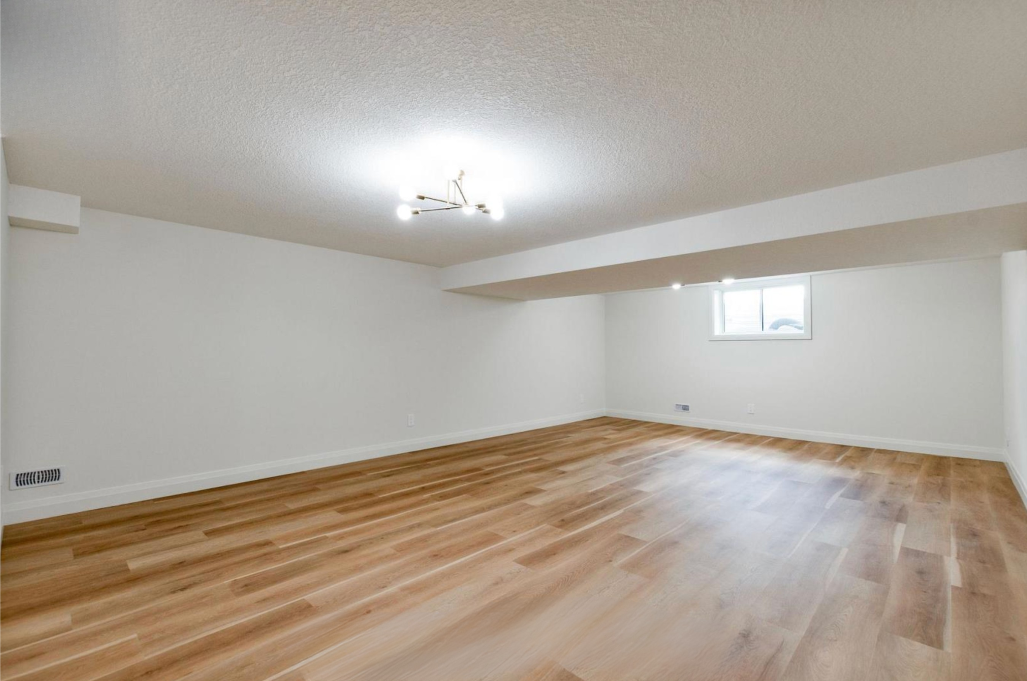 Introducing The Serenity, being built on Lot 11: a luxurious 1-floor bungalow on a 55x128 ft pool-sized lot with a triple car garage, priced at $939,900. This open-concept home features a designer kitchen, great room with gas fireplace, master suite 