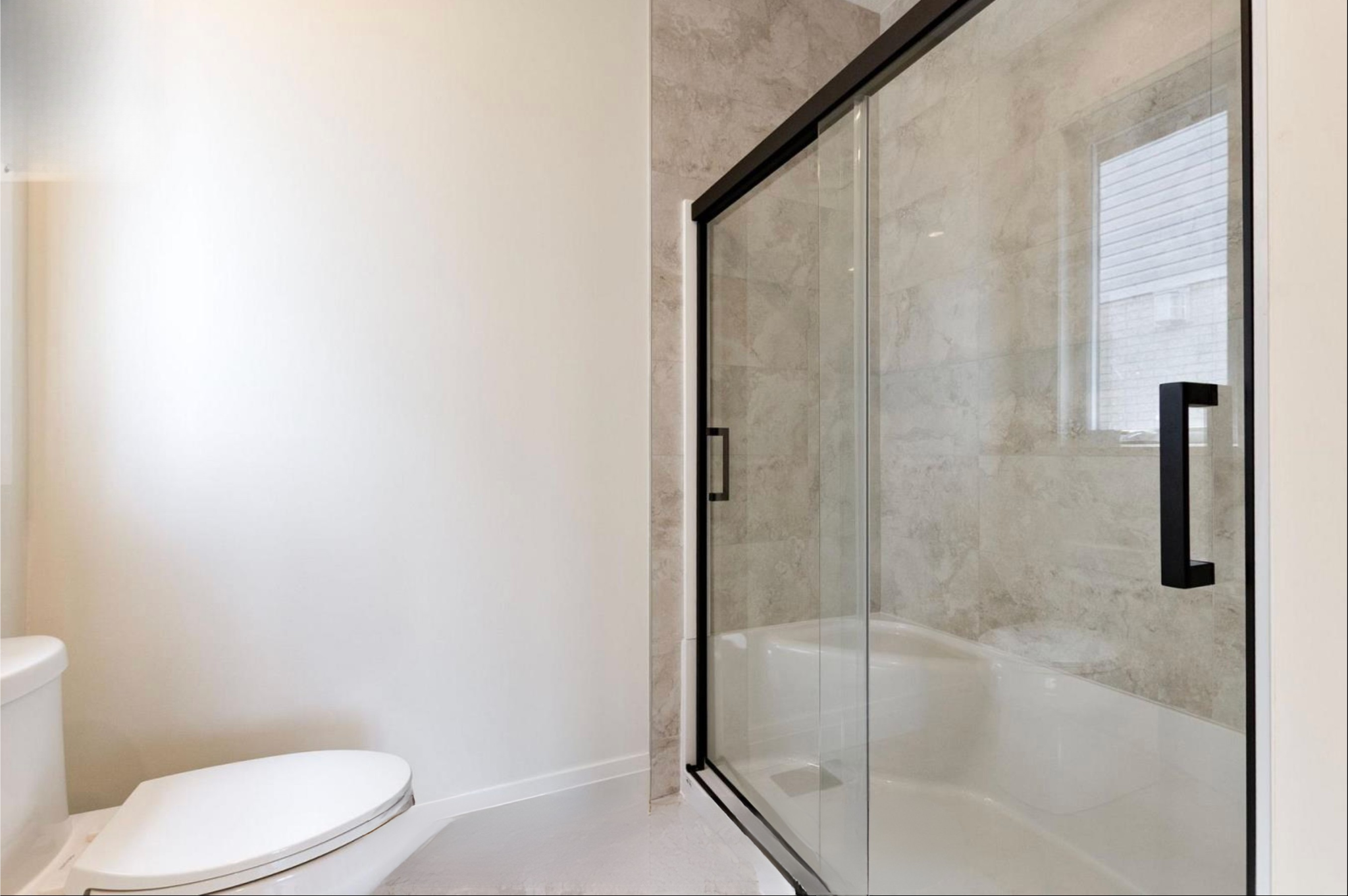 Introducing The Serenity, being built on Lot 11: a luxurious 1-floor bungalow on a 55x128 ft pool-sized lot with a triple car garage, priced at $939,900. This open-concept home features a designer kitchen, great room with gas fireplace, master suite 