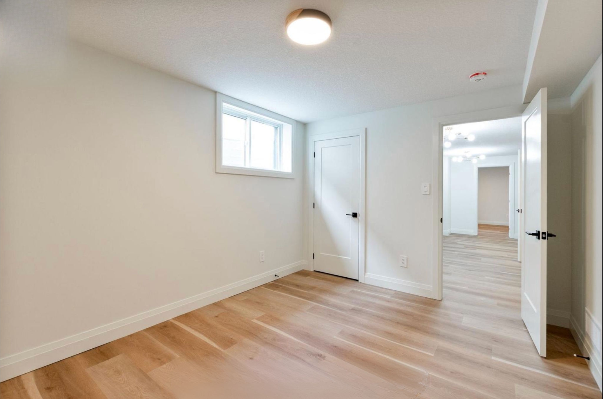 Introducing The Serenity, being built on Lot 11: a luxurious 1-floor bungalow on a 55x128 ft pool-sized lot with a triple car garage, priced at $939,900. This open-concept home features a designer kitchen, great room with gas fireplace, master suite 