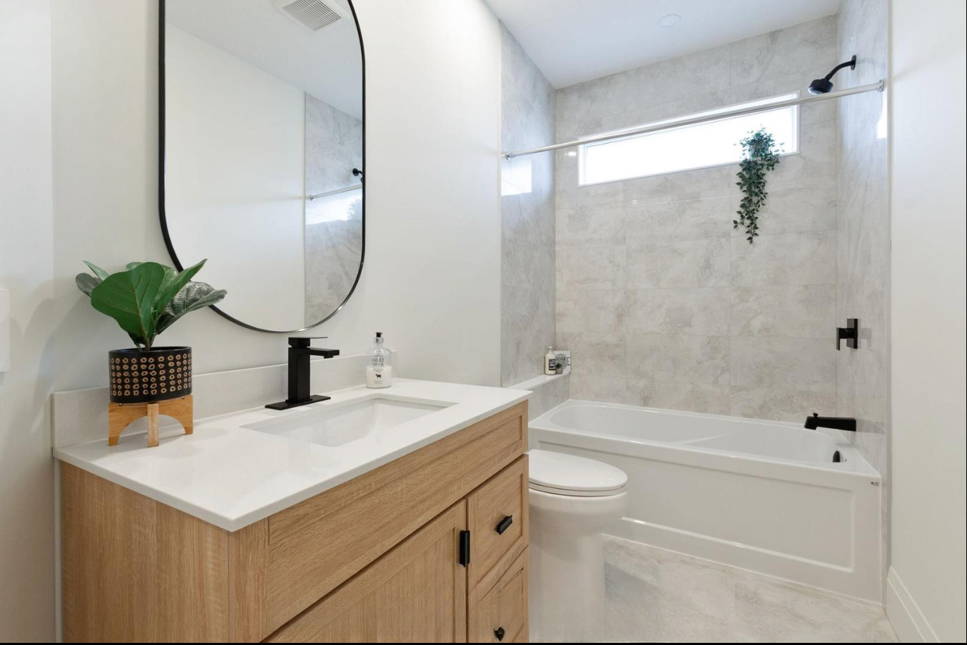 Introducing The Serenity, being built on Lot 11: a luxurious 1-floor bungalow on a 55x128 ft pool-sized lot with a triple car garage, priced at $939,900. This open-concept home features a designer kitchen, great room with gas fireplace, master suite 