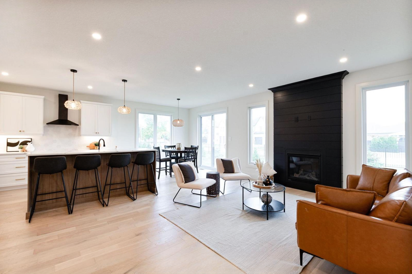 Introducing The Serenity, being built on Lot 11: a luxurious 1-floor bungalow on a 55x128 ft pool-sized lot with a triple car garage, priced at $939,900. This open-concept home features a designer kitchen, great room with gas fireplace, master suite 