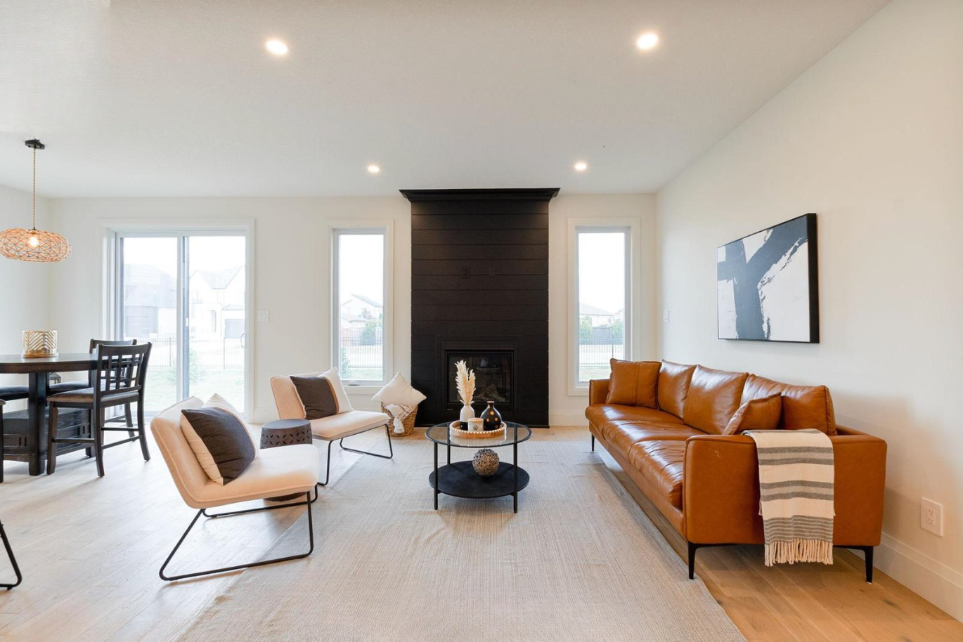 Introducing The Serenity, being built on Lot 11: a luxurious 1-floor bungalow on a 55x128 ft pool-sized lot with a triple car garage, priced at $939,900. This open-concept home features a designer kitchen, great room with gas fireplace, master suite 