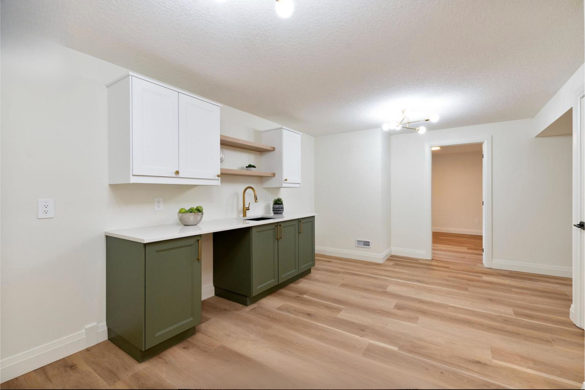 Introducing The Serenity, being built on Lot 11: a luxurious 1-floor bungalow on a 55x128 ft pool-sized lot with a triple car garage, priced at $939,900. This open-concept home features a designer kitchen, great room with gas fireplace, master suite 