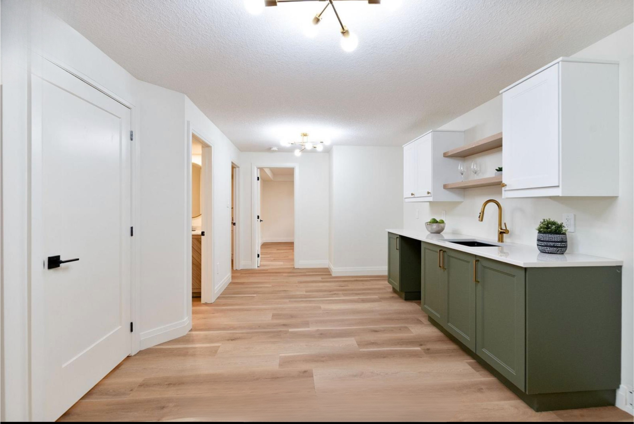 Introducing The Serenity, being built on Lot 11: a luxurious 1-floor bungalow on a 55x128 ft pool-sized lot with a triple car garage, priced at $939,900. This open-concept home features a designer kitchen, great room with gas fireplace, master suite 