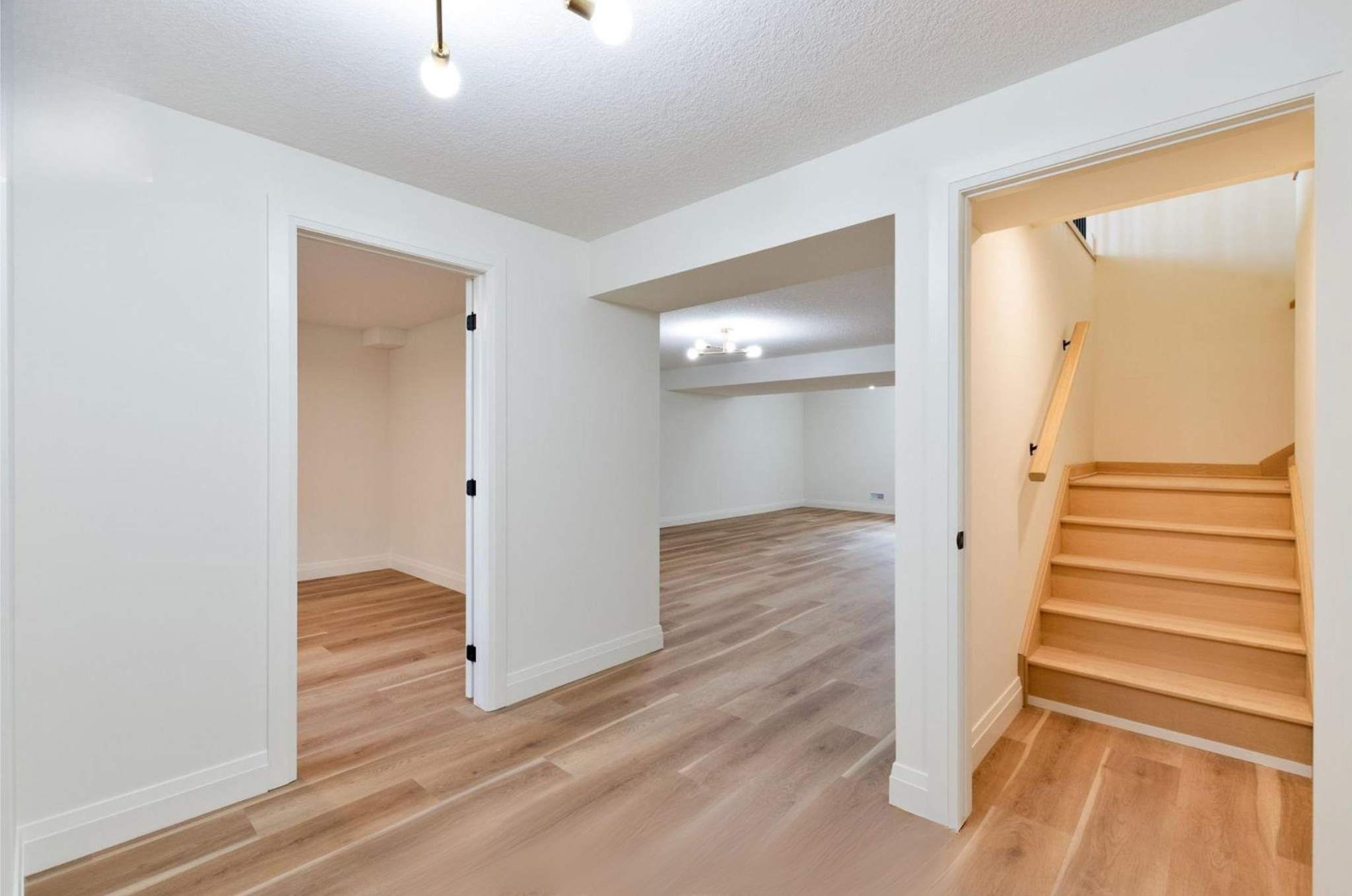 Introducing The Serenity, being built on Lot 11: a luxurious 1-floor bungalow on a 55x128 ft pool-sized lot with a triple car garage, priced at $939,900. This open-concept home features a designer kitchen, great room with gas fireplace, master suite 