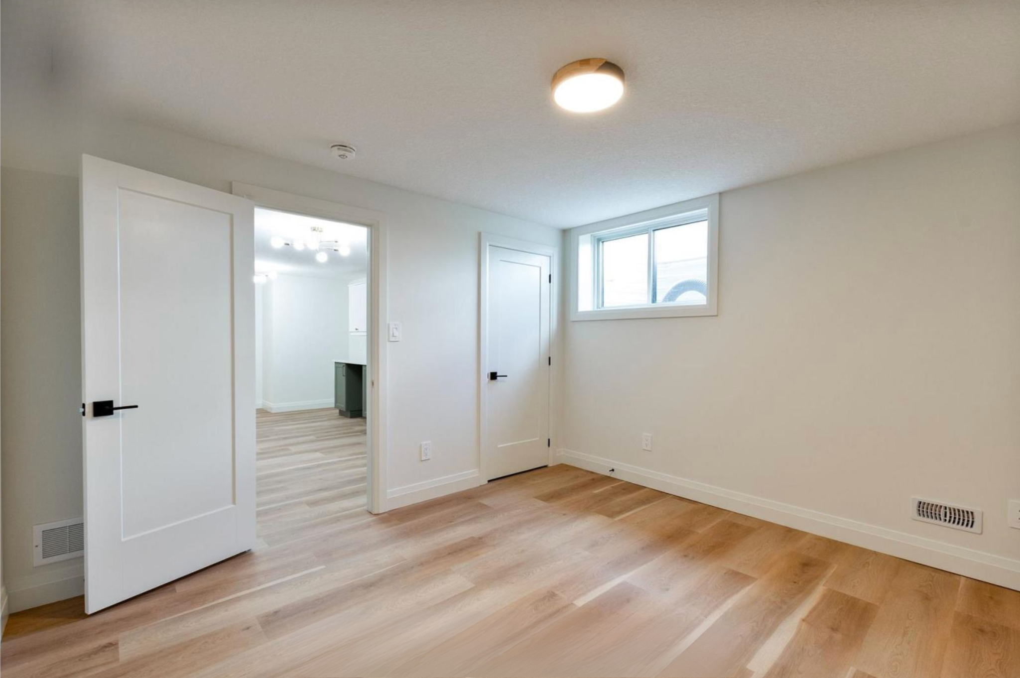 Introducing The Serenity, being built on Lot 11: a luxurious 1-floor bungalow on a 55x128 ft pool-sized lot with a triple car garage, priced at $939,900. This open-concept home features a designer kitchen, great room with gas fireplace, master suite 