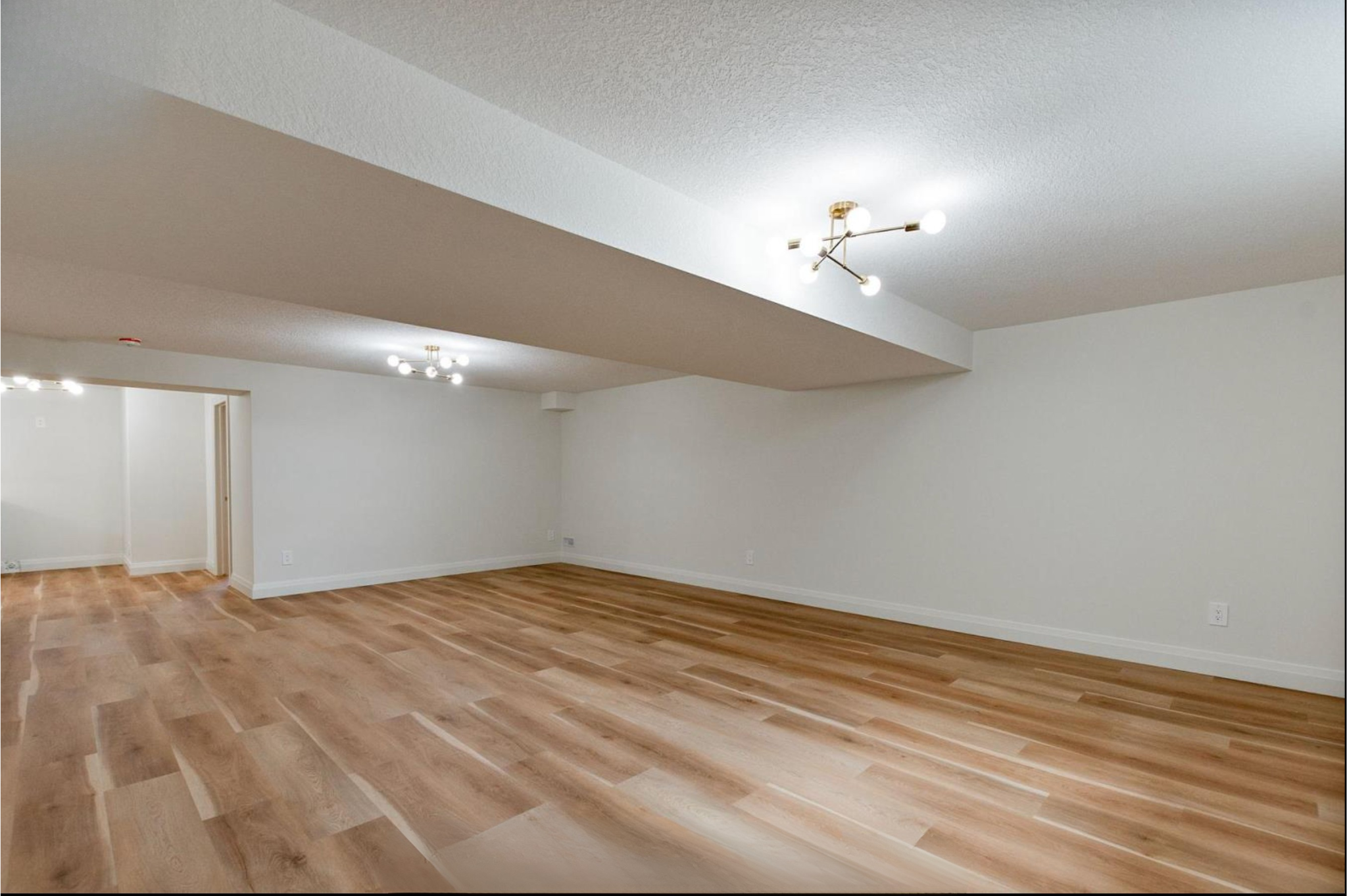 Introducing The Serenity, being built on Lot 11: a luxurious 1-floor bungalow on a 55x128 ft pool-sized lot with a triple car garage, priced at $939,900. This open-concept home features a designer kitchen, great room with gas fireplace, master suite 