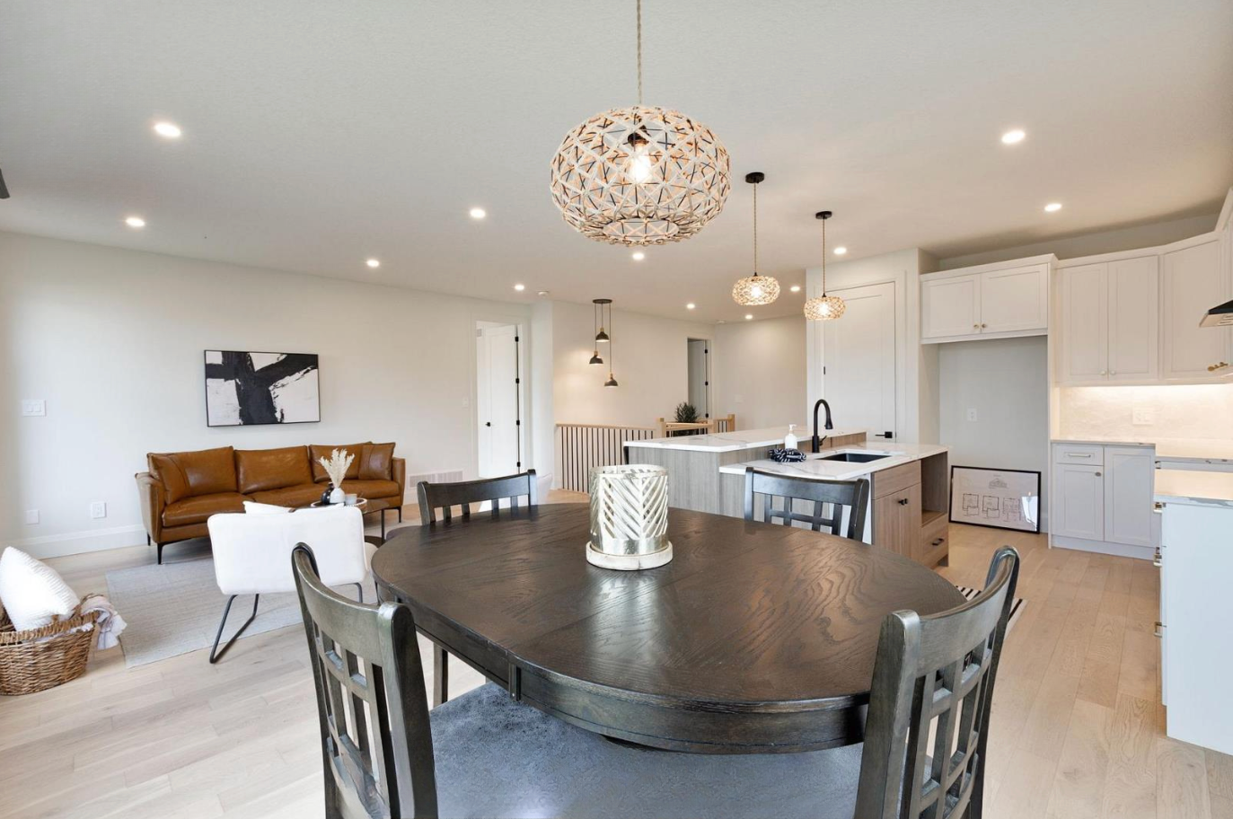 Introducing The Serenity, being built on Lot 11: a luxurious 1-floor bungalow on a 55x128 ft pool-sized lot with a triple car garage, priced at $939,900. This open-concept home features a designer kitchen, great room with gas fireplace, master suite 