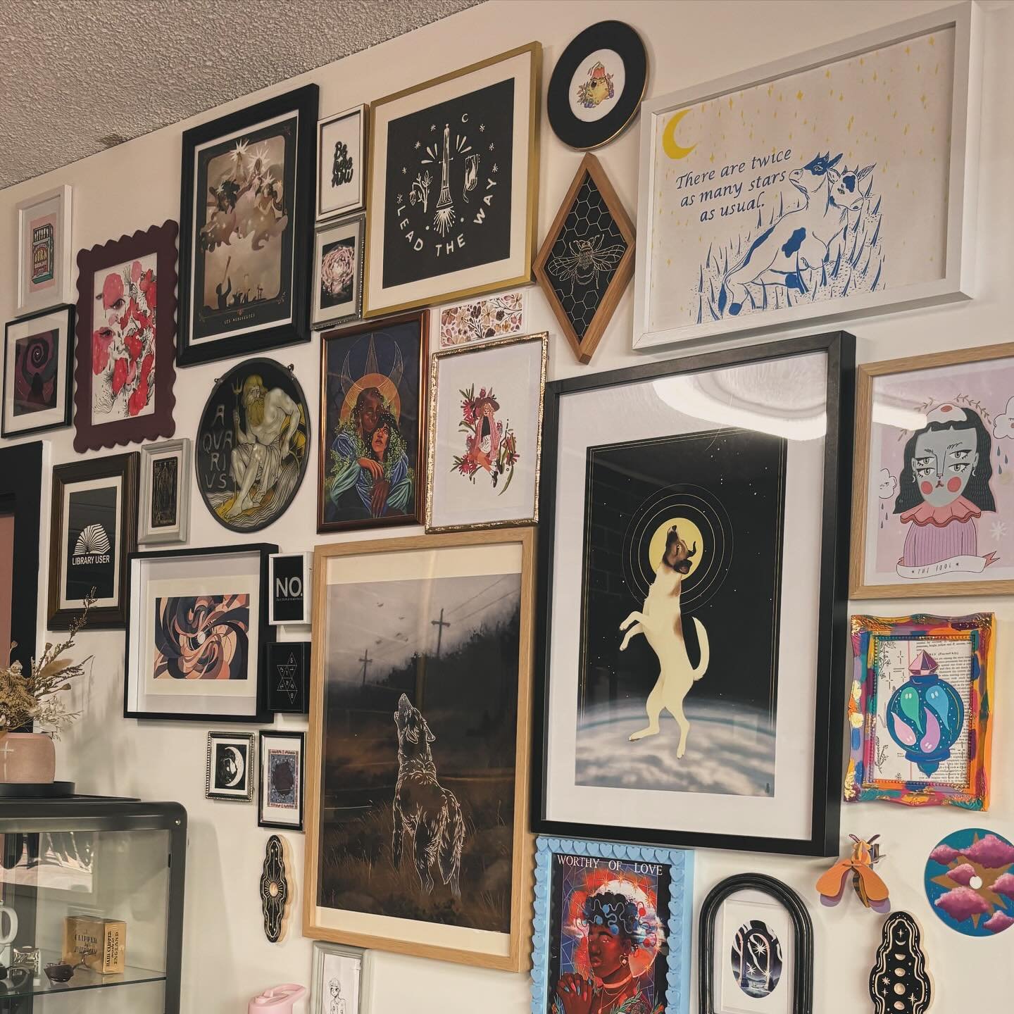 Art always makes a space feel loved. Always building out this gallery wall to add colour and life to the shop.