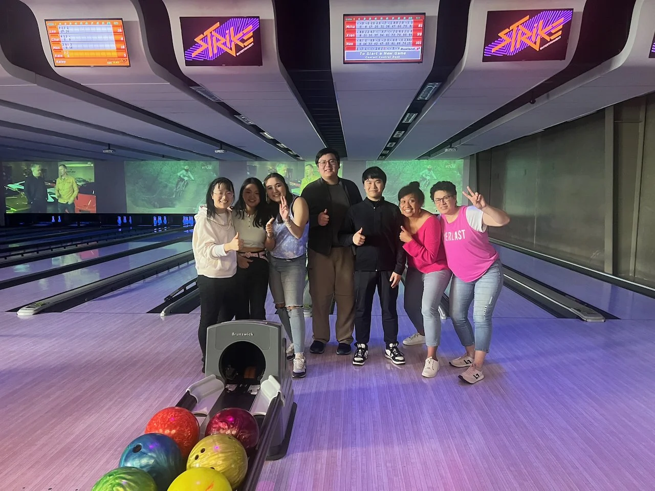 A Photo of all the residents of Kia Maia having fun together at a ten-pin bowling alley in Wellington