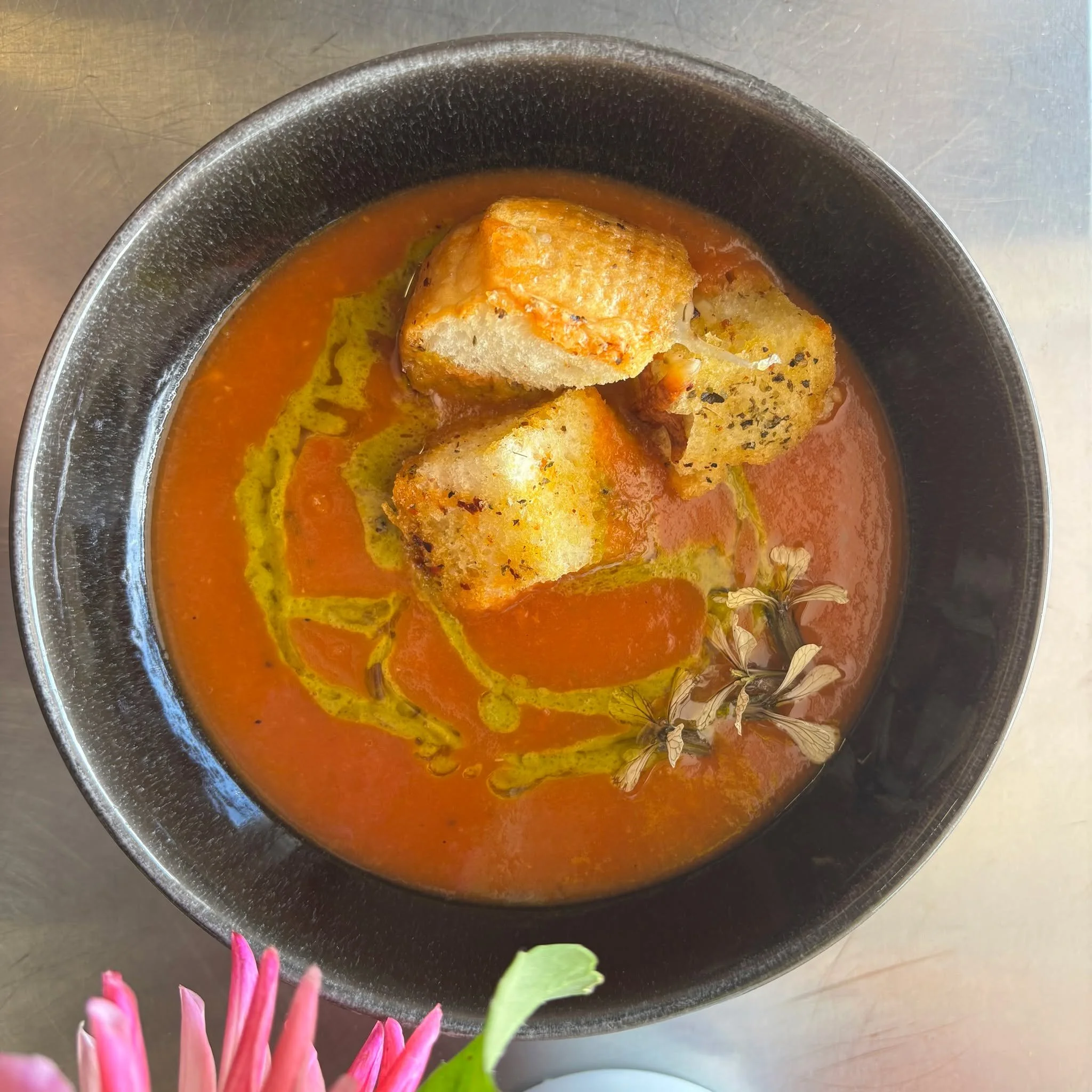 Tuscan Pappa al Pomodoro Soup: local tomatoes, roasted in the oven, then quickly sautéed with anchovies, bread added to create a savory satisfying bowl of soup. In addition we made smoked provolone croutons and basil emulsion to go on top :)