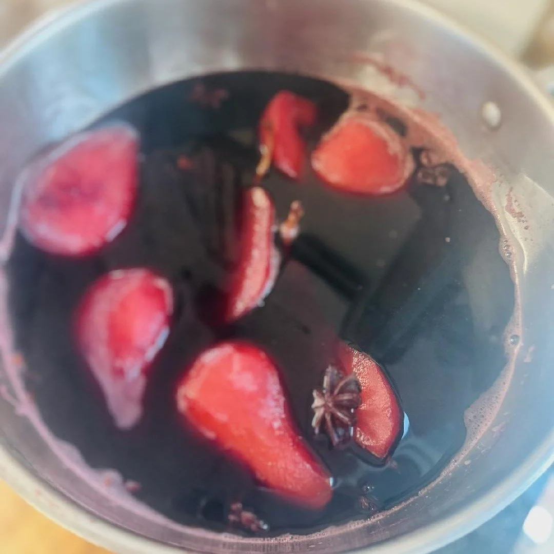 Behind the scenes:  beautiful local pears poached in wine with warm spices like cardamom, baked into an olive oil cake.  It will be served with whipped cream and a poached pear slice.