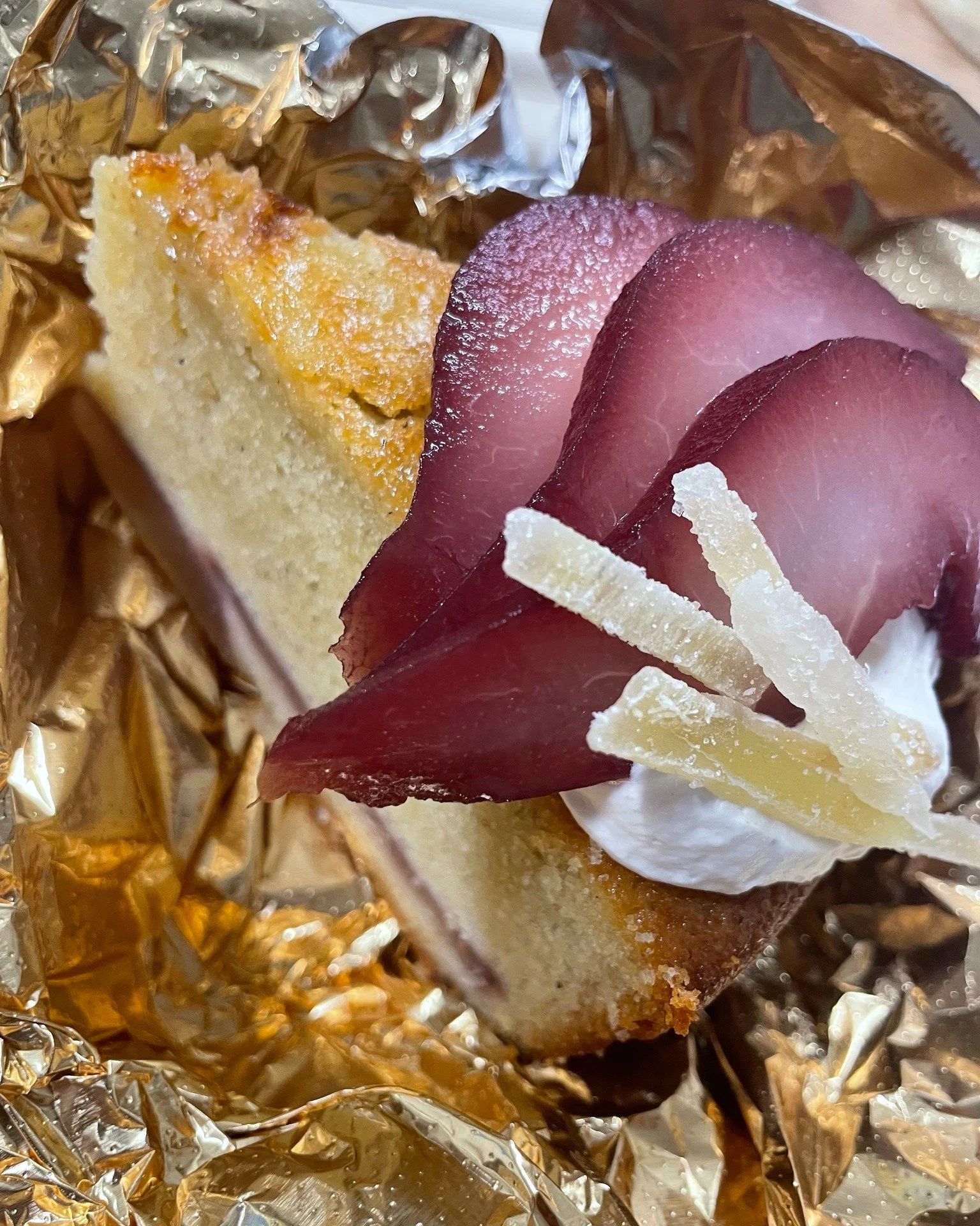 Wine-poached pears on top of, and in a cake. Perfect treat (or consolation) for a rainy day :-)