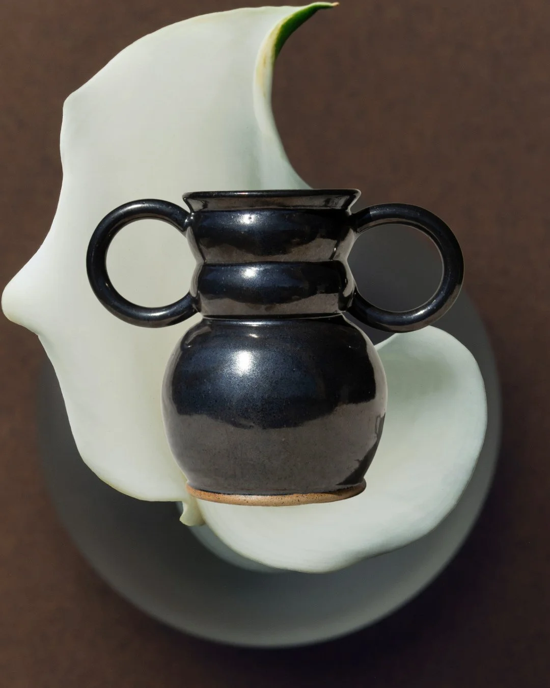 Due to overwhelming involvement the @PottersForPalestine auction is now on the potter's own socials, so hope y'all don't mind the double post 🤠⁠
⁠
Name: Castor Ceramics⁠
Title: Guadalupe Vase⁠
Materials: Stoneware, Food Safe Glaze⁠
Dimensions: W 12&