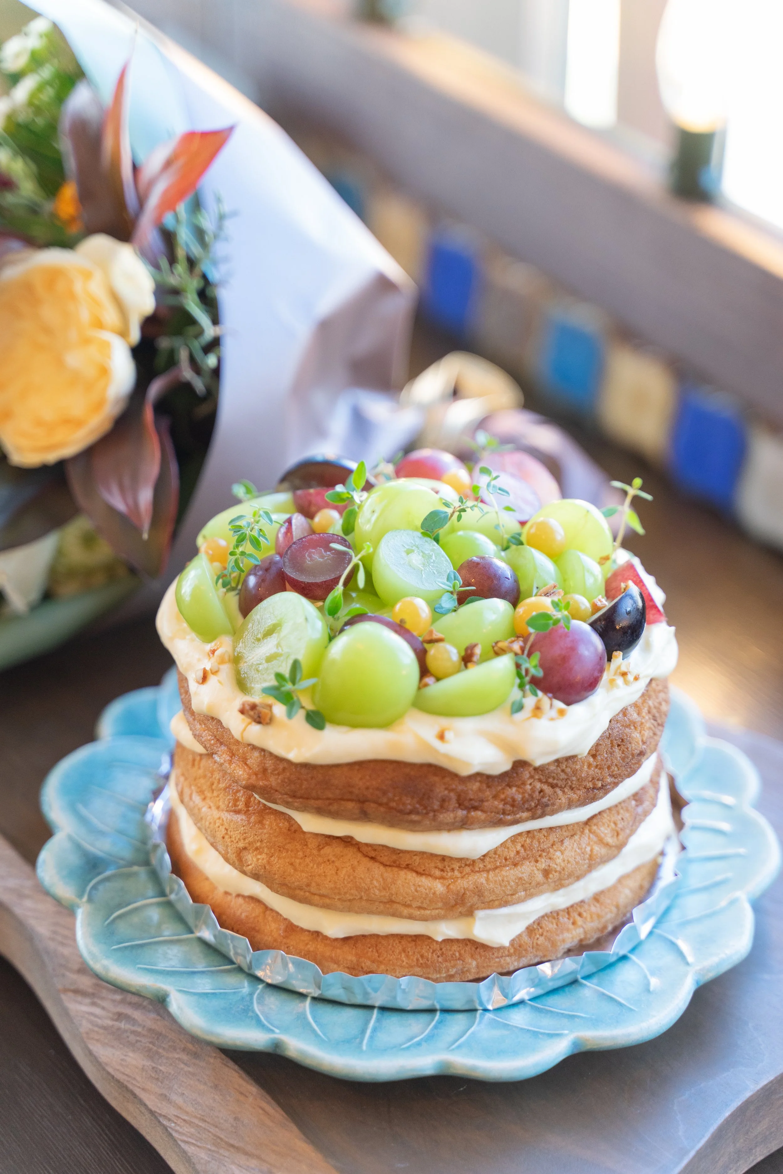 A 15 cm anniversary cake topped generously with Shine Muscat grapes