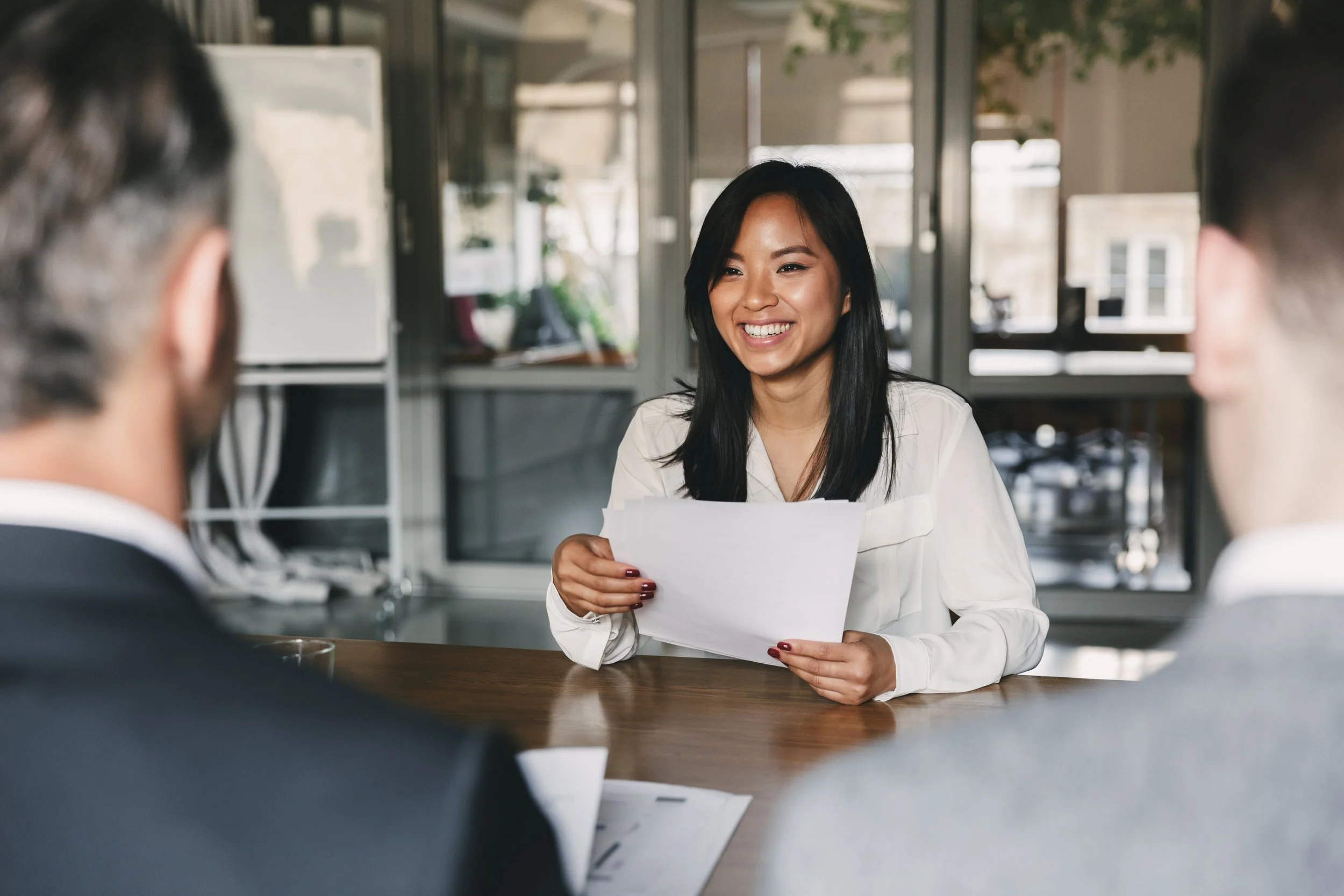 An excited woman in a meeting with her union
