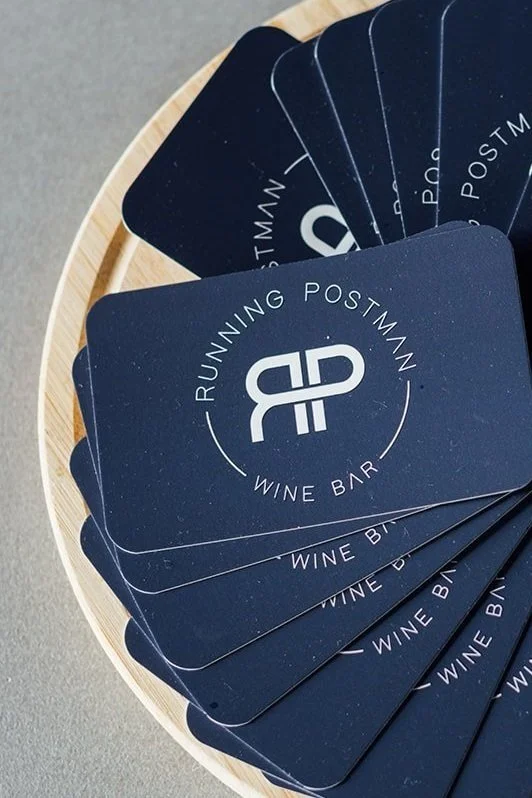 Running postman wine bar business cards