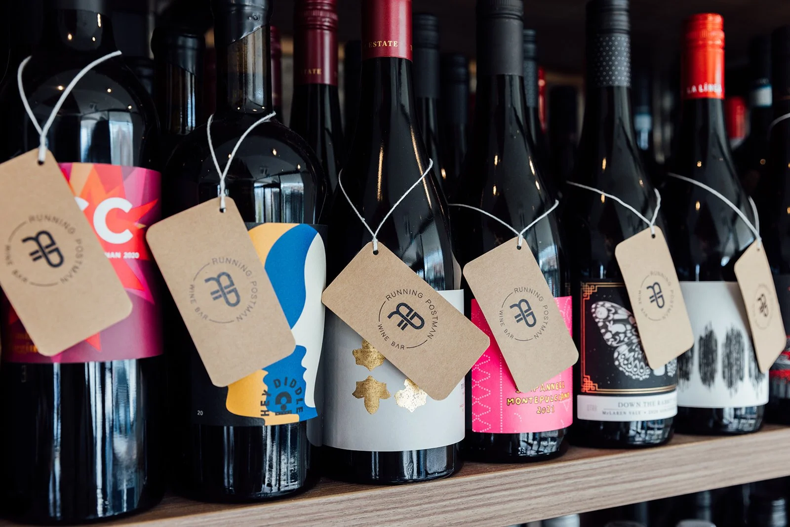 Let us help you choose a bottle of Wine from the wall! 