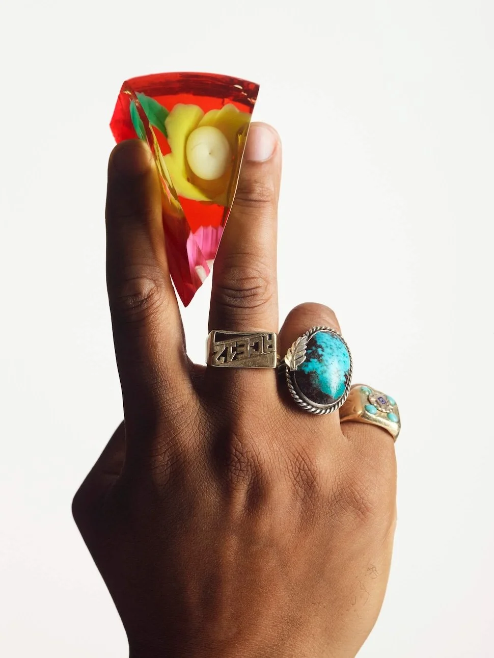 Hand holding a Solid Wiggles cocktail-inspired jelly cake.