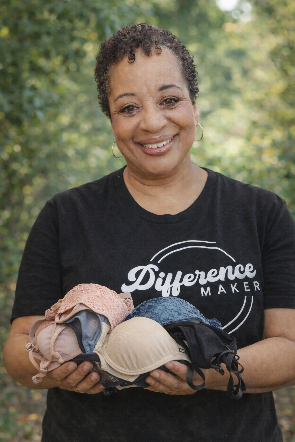 Women holding bras for donation