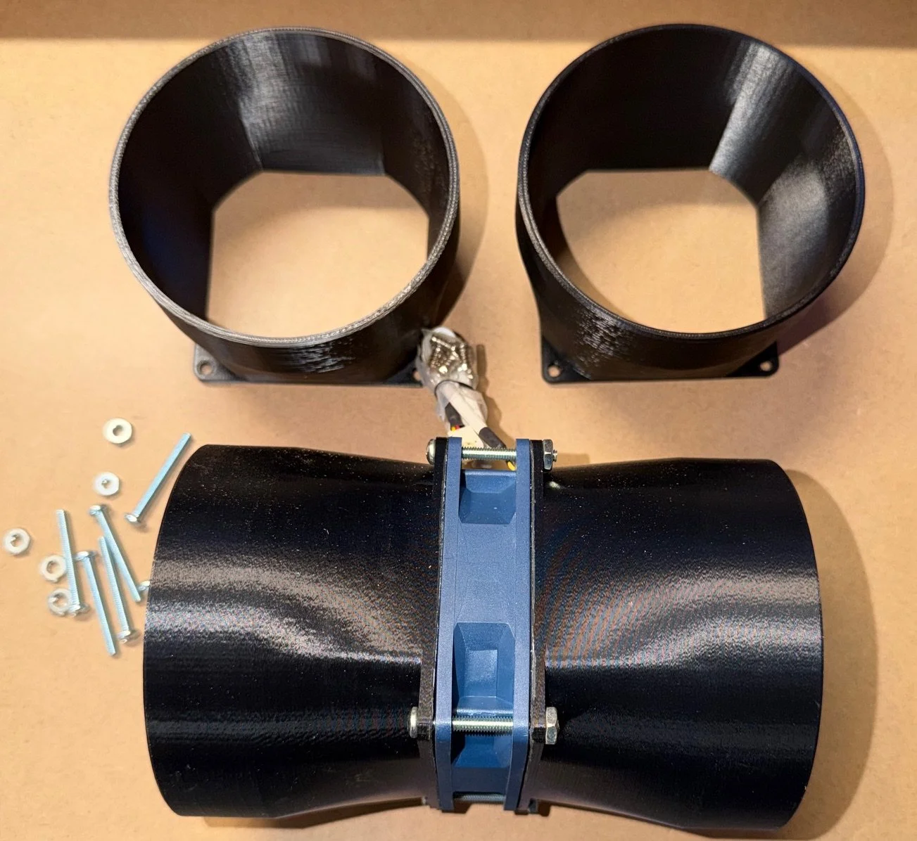 Custom engineered fan adapter assembly for testing airflow, spacing, and functional integration.