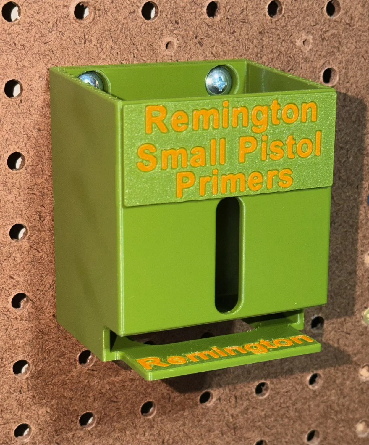 Close view of the top-loading Remington Small Pistol primer organizer designed to dispense primer packs from the bottom.