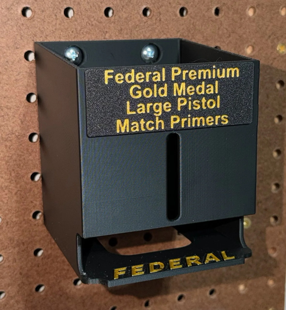 Pegboard‑mounted organizer for Federal large pistol match primer packs.