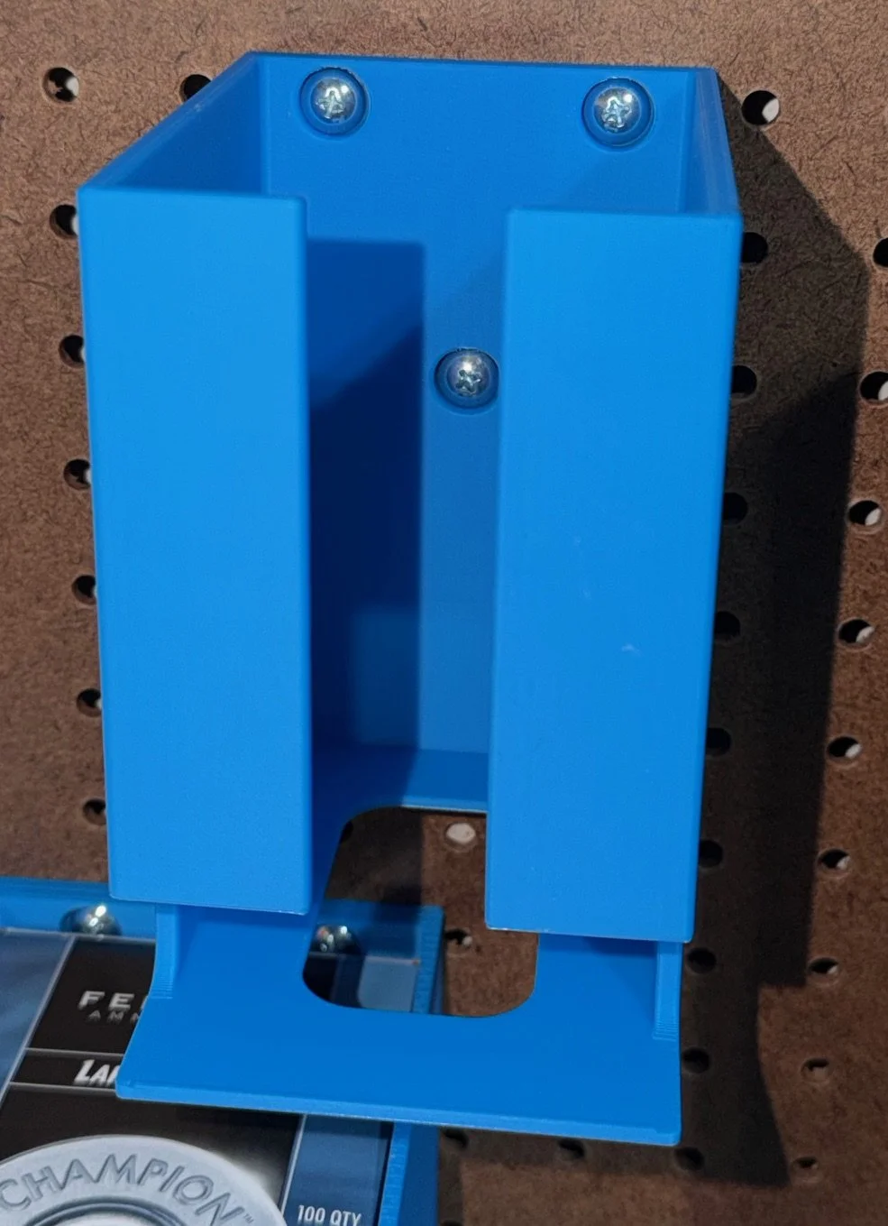 An empty Dillon 550 Caliber Conversion 5 Kit Holder mounted on pegboard.