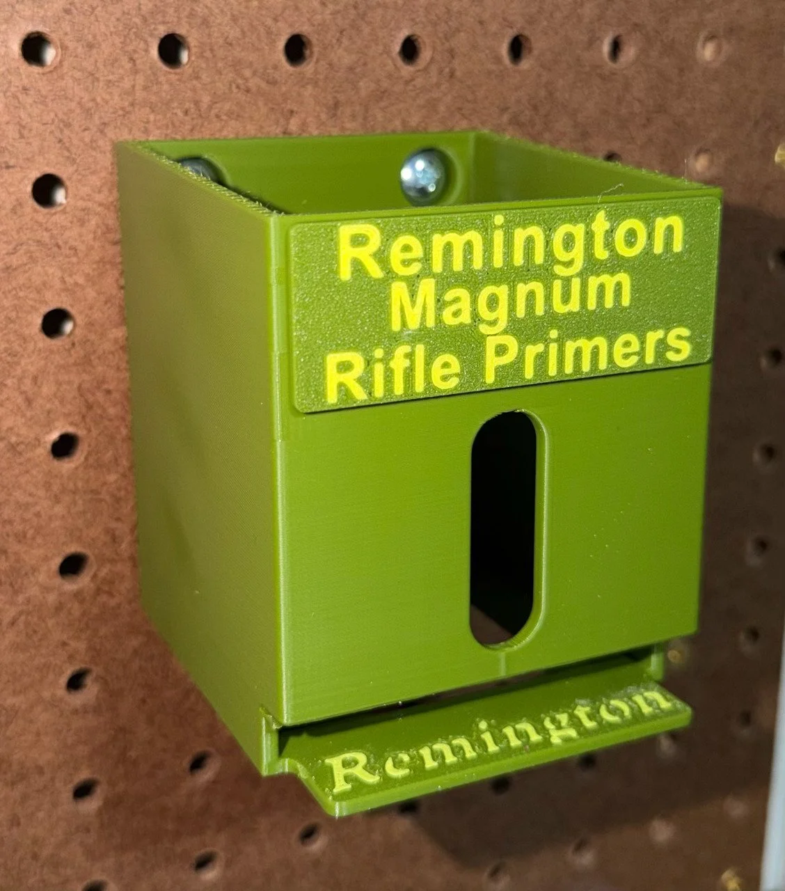 Close view of the top-loading Remington No. 9 1/2 Magnum Rifle primer organizer, designed to dispense packs from the bottom.
