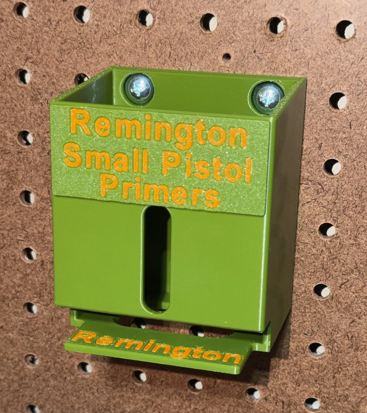 Wall- or bench-mounted Remington Small Pistol primer pack organizer with five vertical storage slots and included mounting hardware.